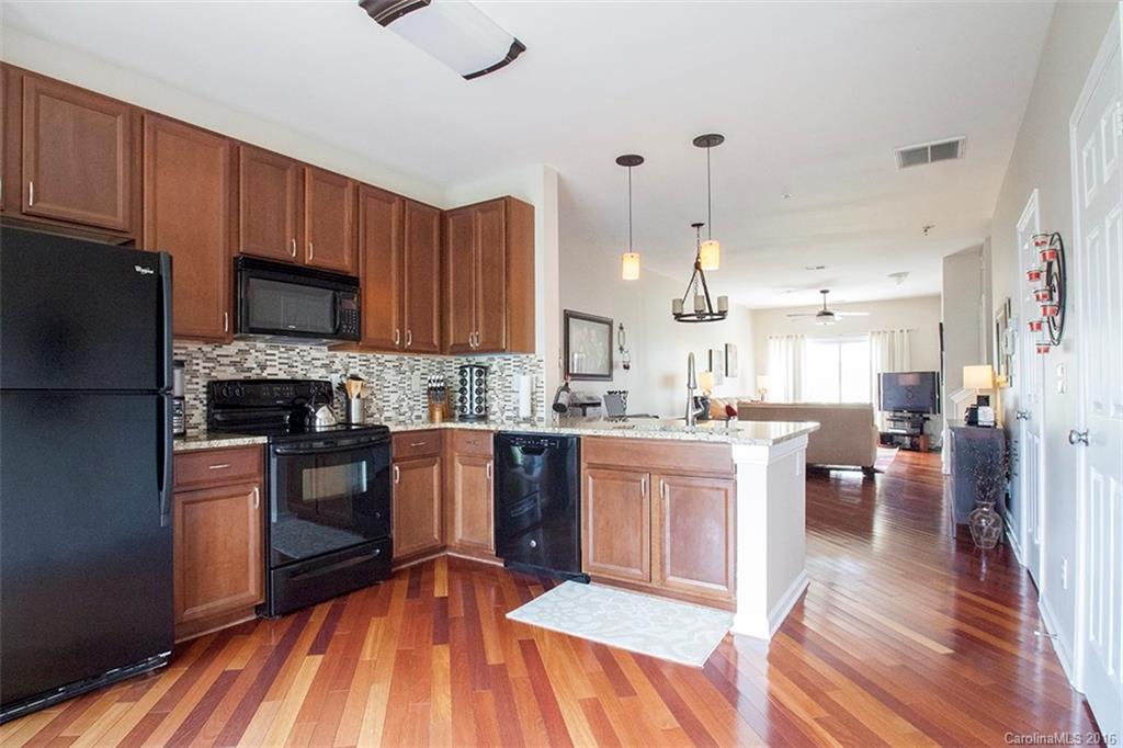 Upgraded unit available in fantastic NoDa location! Only a few blocks to the new Lynx Light Rail. Beautiful Brazillian Cherry hardwood floors throughout main level. Recent kitchen upgrades include an eat in bar as well as granite counter tops. Spacious bedroom and master bath. Seller will convey the washer and dryer to the buyers at no additional cost. This is one of the nicest units to ever hit the market in the The Renaissance. A must see! Exterior cosmetics being addressed/remedied by HOA.
