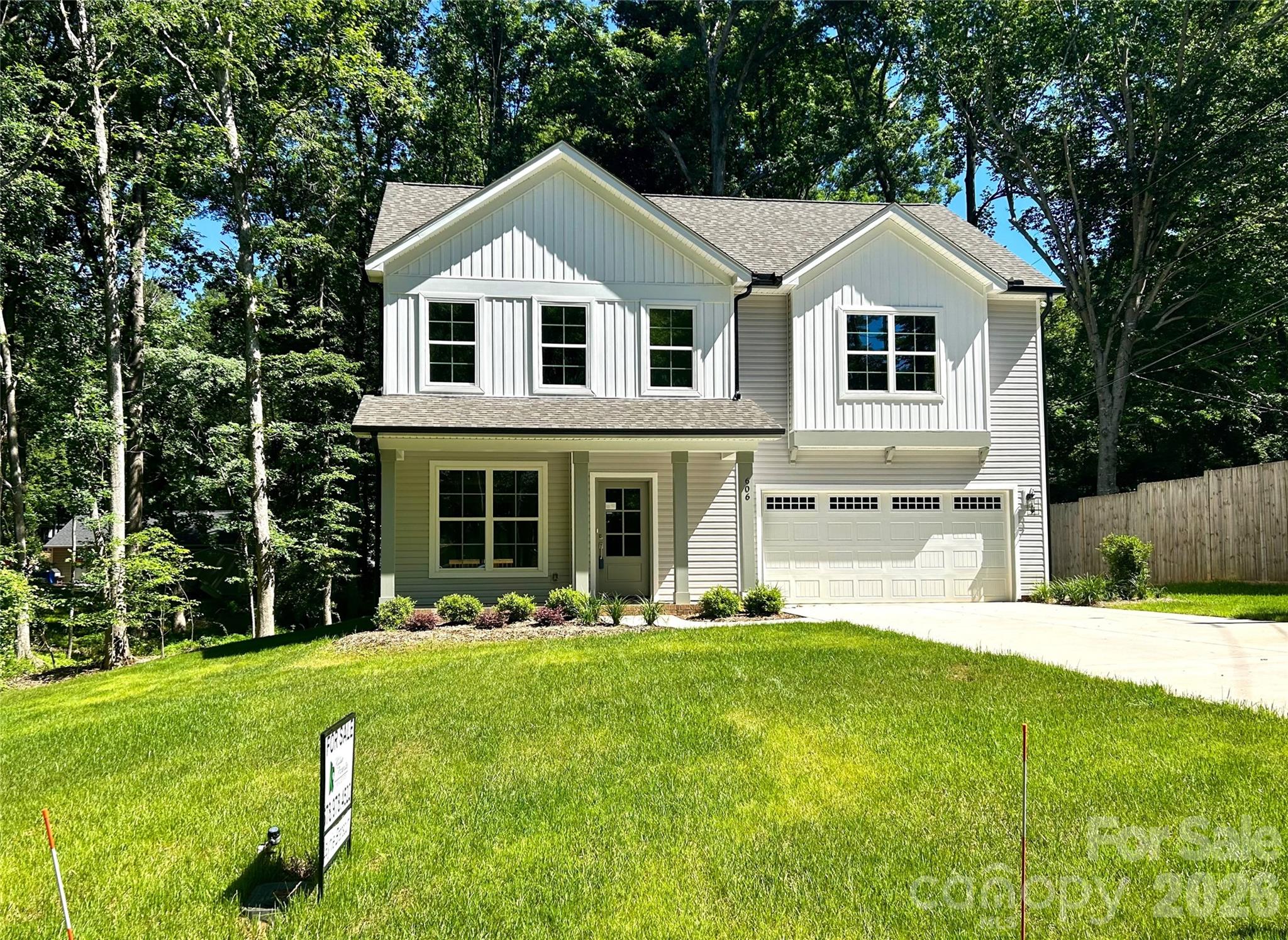 Welcome to this brand new custom home nestled perfectly in a quiet neighborhood just minutes from historic downtown Waxhaw. Enjoy the beautiful community park, coffee shops, boutiques, and local pubs just a quick stroll away from home. The main level is an open floor plan with 9 ft ceilings, beautiful wide hardwoods throughout including the staircase, and upper-level hallways. The kitchen is thoughtfully designed featuring a huge island, SS farm sink, Quartz counter-tops, large pantry with solid shelving, a double oven, 42" wall cabinets, soft-close doors + drawers, along with under-cabinet LED lighting. You'll also find a mudroom with a built-in drop-zone with a bench and cubbies, a well-placed half bath, and laundry room with additional storage. Sliding doors off of the dining area leading to the back deck and back yard for family fun or relaxation.
Upstairs, you'll find a massive primary suite with walk-in closet and en-suite bathroom. Primary bathroom features tall double vanities and designer tile & frameless walk-in shower.  The secondary bedrooms are generously sized, and closets all have solid shelving. All bedrooms are pre-wired for ceiling fans.
Fully finished and painted, attached 2-car garage and expansive driveway with lots of room for parking. Covered front porch. Don't miss your chance to enjoy all that Waxhaw has to offer with the ease of owning a brand new, fully warranted home with no HOA!
