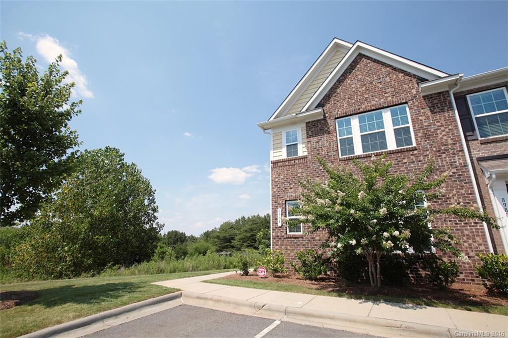 This is a townhouse you do not want to let slip by!  Nestled beautifully in the oh-so desired community of Almond Glen in Indian Land, SC, you are literally less than one minute from both Fort Mill, SC and Pineville, NC.  This gorgeous end unit townhouse boasts new paint, new carpet, open floor plan, tiled backsplash, master suite down,  private back yard and fantastic sized bedrooms!!  USDA 100% financing eligible.