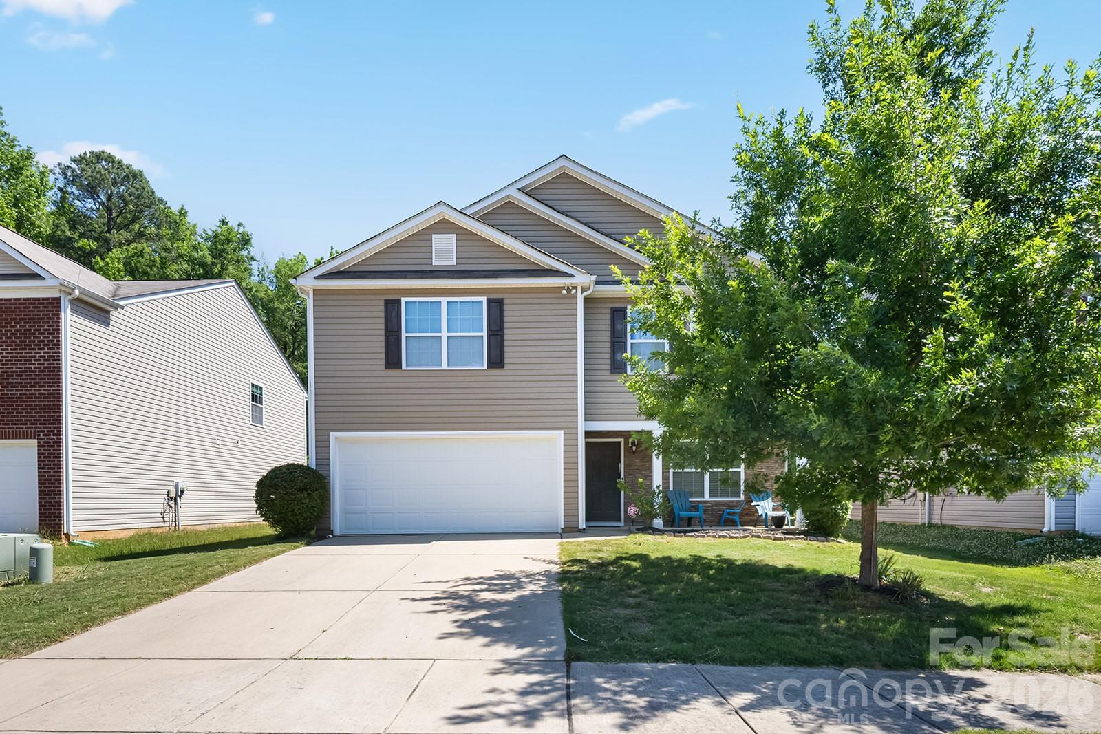 Welcome to 5329 Park Brook Drive, a beautifully maintained 4-bedroom, 2.5-bath home offering approximately 2,200 square feet of comfortable living space in a convenient North Charlotte location. The open-concept main level features a spacious family room with fireplace, formal dining area, and an inviting kitchen complete with stainless steel appliances, ample cabinet space, and a center island perfect for gathering. Upstairs, you'll find a generous primary suite with a walk-in closet, spacious secondary bedrooms, a large bonus room ideal for a playroom, media room, home office, or second living area, and a convenient upstairs laundry room. Step outside to a private backyard backing to mature trees, creating a peaceful setting for entertaining or relaxing. Conveniently located near Concord Mills, I-485, I-85, shopping, dining, and everyday amenities, this move-in ready home offers the space and location today's buyers are searching for.