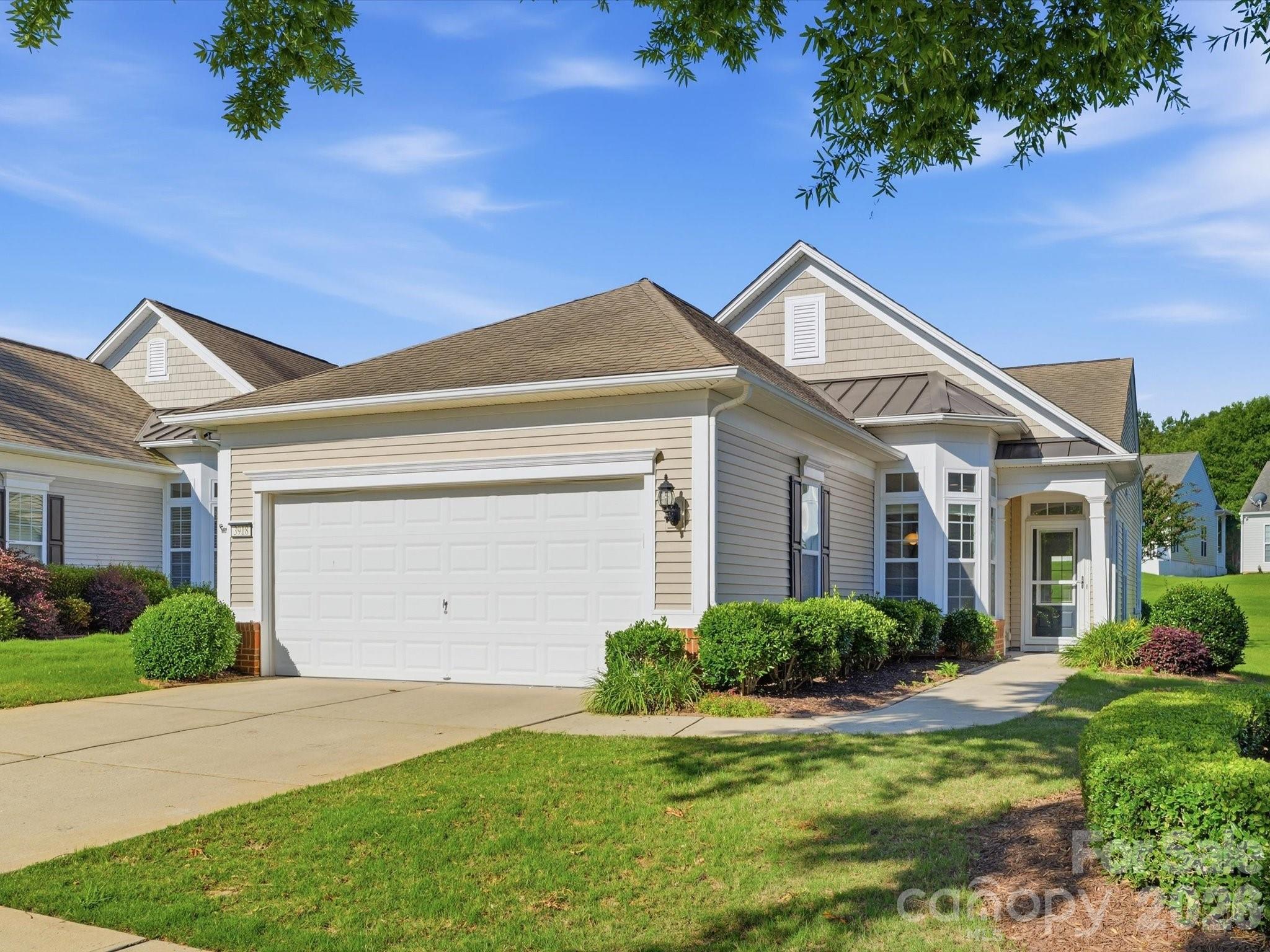 Welcome to the good life in Sun City Carolina Lakes!  Popular Gray Myst floorplan with sunroom.  Brand new flooring installed June 2026- LVP in dining room, family room and sunroom; new carpet in bedrooms. Eat-in kitchen with granite countertops, tile backsplash, stainless appliances, and built-in desk.  The dining room and great room flow into the bright sunroom, which opens to an extended patio with retractable awning and the beautifully landscaped backyard.
Spacious primary bedroom with walk in closet, bathroom with dual vanities, large tiled shower with grab bars. 
Two additional bedrooms are perfect for guests, hobbies, or office space.
This home is bright and neutral - move in ready!  Sun City Carolina Lakes is a Del Webb 55+ Active Adult Community with fabulous amenities and activities.  3918 Yosemite is conveniently located near the back entrance to the neighborhood for easy access.
