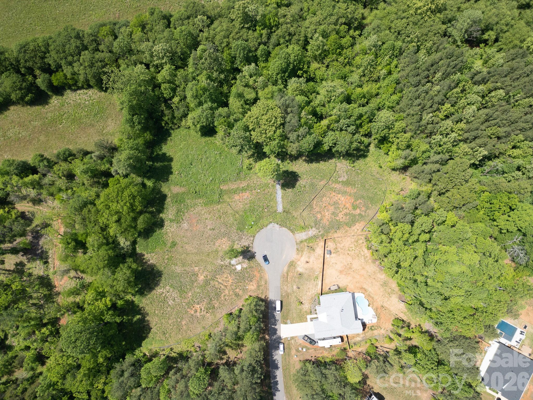 Build your dream home on this 1.84 Acre lot located on a quiet cul-de-sac within the Powder Spring Creek subdivision! Conveniently located near many amenities and I-77 providing easy access to Statesville, Mooresville, Lake Norman and Charlotte. The neighboring lot (128 Spring View Lane) is also available! Septic permit, well permit, survey, and engineered house plans are available!