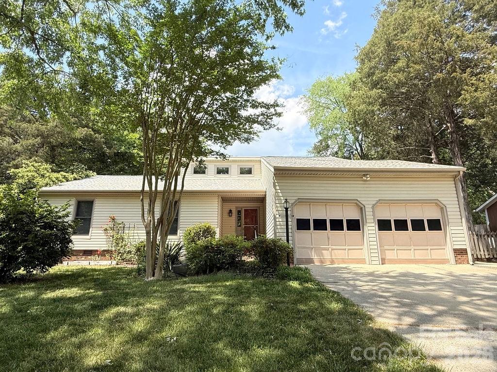 Rare opportunity on a cul-de-sac! This home has been thoughtfully maintained by its original owners.  It is a 3-bedroom, 2-bath home offering approximately 2,000+ square feet of comfortable living space and a unique blend of character and functionality. It features hardwood floors in the main living areas and a spacious living room with vaulted ceilings that create an open, airy feel. The kitchen offers laminate flooring, cabinetry, pantry space, and great natural light. Adjacent dining and living spaces provide an easy flow for everyday living and entertaining. The primary suite includes two closets, built-ins, and an ensuite bath with accessibility features such as handrails and a bench. Two additional bedrooms are generously sized with storage and share a secondary bathroom. A standout feature is the detached heated and cooled workshop/bonus space with shelving-ideal for a home office, studio, or hobby area. Additional attic storage is available. Enjoy beautifully landscaped outdoor spaces with mature trees, brick patio areas, pergola seating, and garden paths. Outdoor benches, attached storage, and a shed remain.

*Tucked away on a cul-de-sac yet convenient to shopping and dining, this home offers flexible space, charm, and comfort-ready for its next owner.

Major updates include Anderson windows (2020), HVAC system (2023), hot water heater (approx. 2020), and roof replaced (2023).
