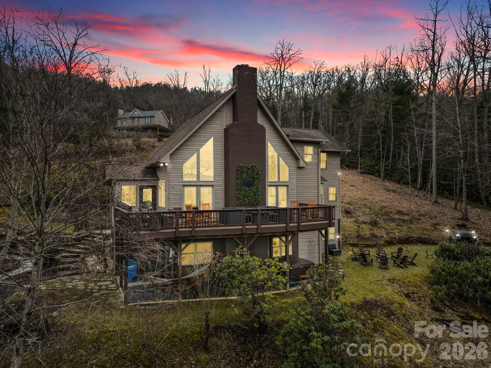 Escape to your own private mountain retreat at 106 Bishop Cove Rd in Fairview—a rare opportunity to own a beautifully remodeled mountain home just minutes from Asheville. Currently enjoyed as both a second home and successful Airbnb retreat, this property offers exceptional flexibility for personal enjoyment, investment potential, or full-time mountain living. Featuring 3 bedrooms, 3 bonus rooms, and 3 full baths across 3,400+ sq ft, this thoughtfully designed home blends rustic charm with modern comfort. Inside, you'll find vaulted ceilings, abundant natural light, and an open-concept layout ideal for entertaining or relaxing. The updated kitchen features stainless steel appliances, custom finishes, pot-filler taps, and thoughtful upgrades throughout. The spacious owner’s suite offers a private sitting area, ensuite bath, and peaceful outdoor access. Step outside to enjoy long-range mountain views, multiple outdoor decks, and the natural beauty of Western North Carolina. Conveniently located approximately 20 minutes from downtown Asheville, shopping, dining, hiking, and local attractions. Seller is offering a 1-year home warranty for added peace of mind. Offering exceptional value in today’s mountain market. * Seller / Owner Financing is available * Move-in ready - fully furnished with accepted offer and a rare opportunity in one of Fairview’s most scenic settings.