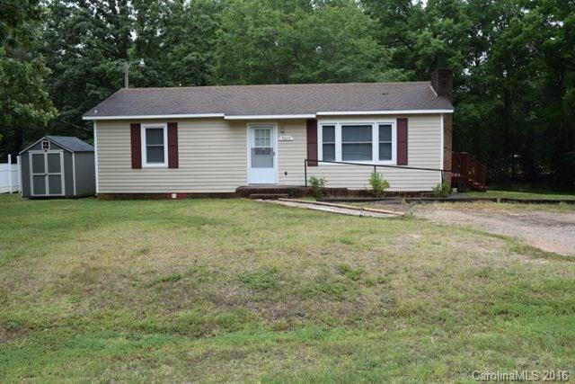 What a great home with a huge deck that was built in 2015!  This ranch home sits on half an acre, has two bedrooms and one updated bath.  Spacious great room with fireplace, great kitchen with large work island and an eating area.  Replacement windows throughout, small storage building will remain.  Cute as can be!