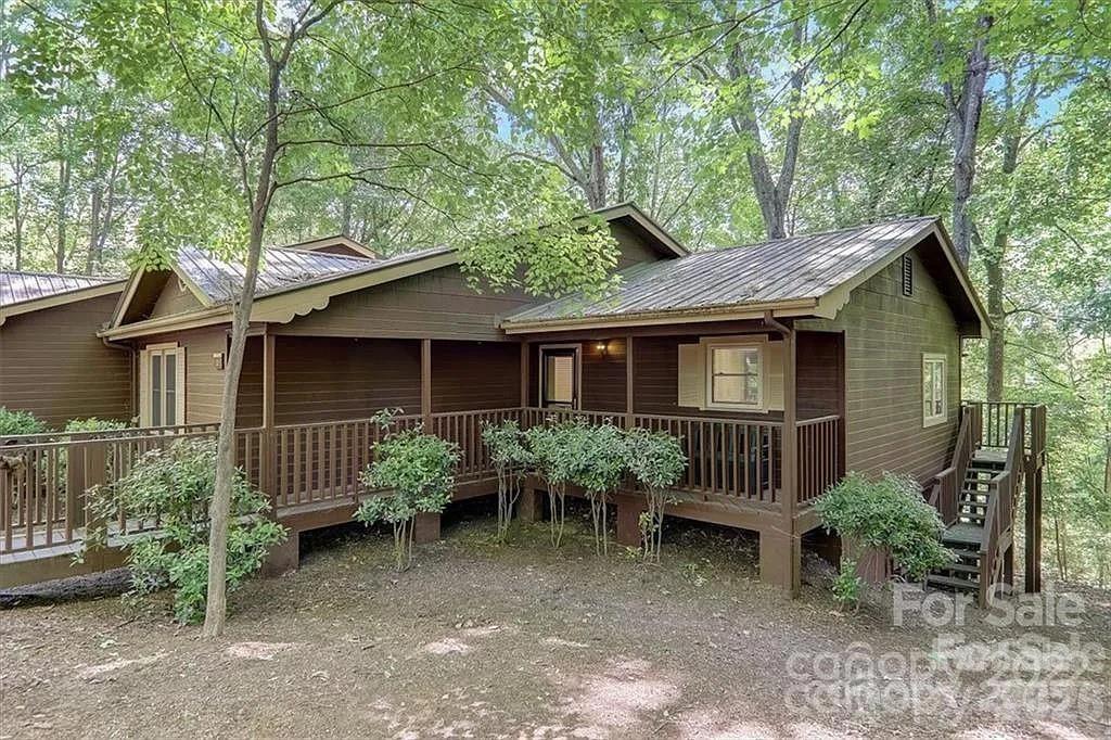 Golfers, you will not find a better deal in the heart of Lake Lure!!  Welcome to a dream oasis nestled in serene beauty of Lake Lure! Unit 2 is an updated townhouse offering a harmonious blend of comfort and leisure. Bright & airy generous living space feels much bigger than actual sqft. 2BR/2BA catering perfectly to both relaxation and guest entertainment while creating lifelong memories. Located on the Apple Valley Golf Course, this property not only promises mesmerizing views but also an unparalleled golfer's retreat.Imagine stepping out your door and onto the greens. It's the perfect lifestyle for golf enthusiasts or those seeking a tranquil escape surrounded by nature's beauty. It offers access to the myriad of amenities at the Rumbling Bald Resort, ensuring every day feels like a vacation.For those considering an investment opportunity, the appeal as a rental is unmatched due to the desirable location, resort-style amenities and the natural lure of Lake Lure's nearby attractions.  Furniture conveys with purchase with exception of personal art.