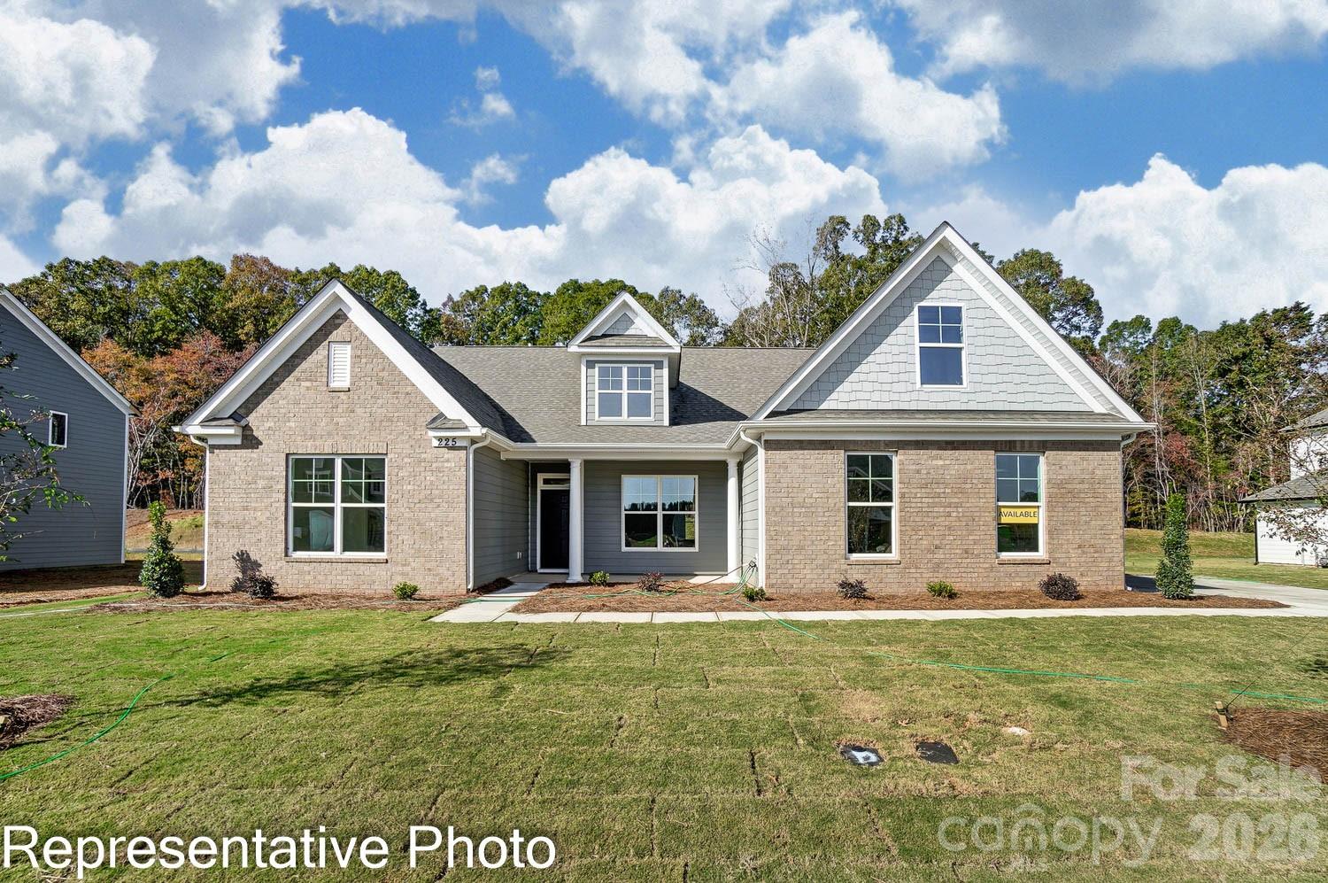 This 1.5-story Asheboro plan offers 4 bedrooms, 3.5 baths, a 3-car garage, and 3,200 square feet of living space! The main floor features a dining room with tray ceiling, family room with a gas fireplace flanked by built-in cabinets, two secondary bedrooms, and the primary suite. The primary bedroom has a tray ceiling, and the primary bathroom has a tiled shower and tub with tile surround. The designer kitchen has a shiplap range hood, a farmhouse sink, cabinets that extend into the breakfast area, quartz cabinets, and stainless appliances, including a gas cooktop. A butler pantry with upper and lower cabinets connects the kitchen and dining room. The main floor also has a mud room with drop zone, laundry room, a full bath, and a half bath. The upper floor has a loft, bedroom, and full bath with a tub/shower combo. All secondary baths have white cabinetry and white quartz counters. Visit today and make this beautiful home yours!