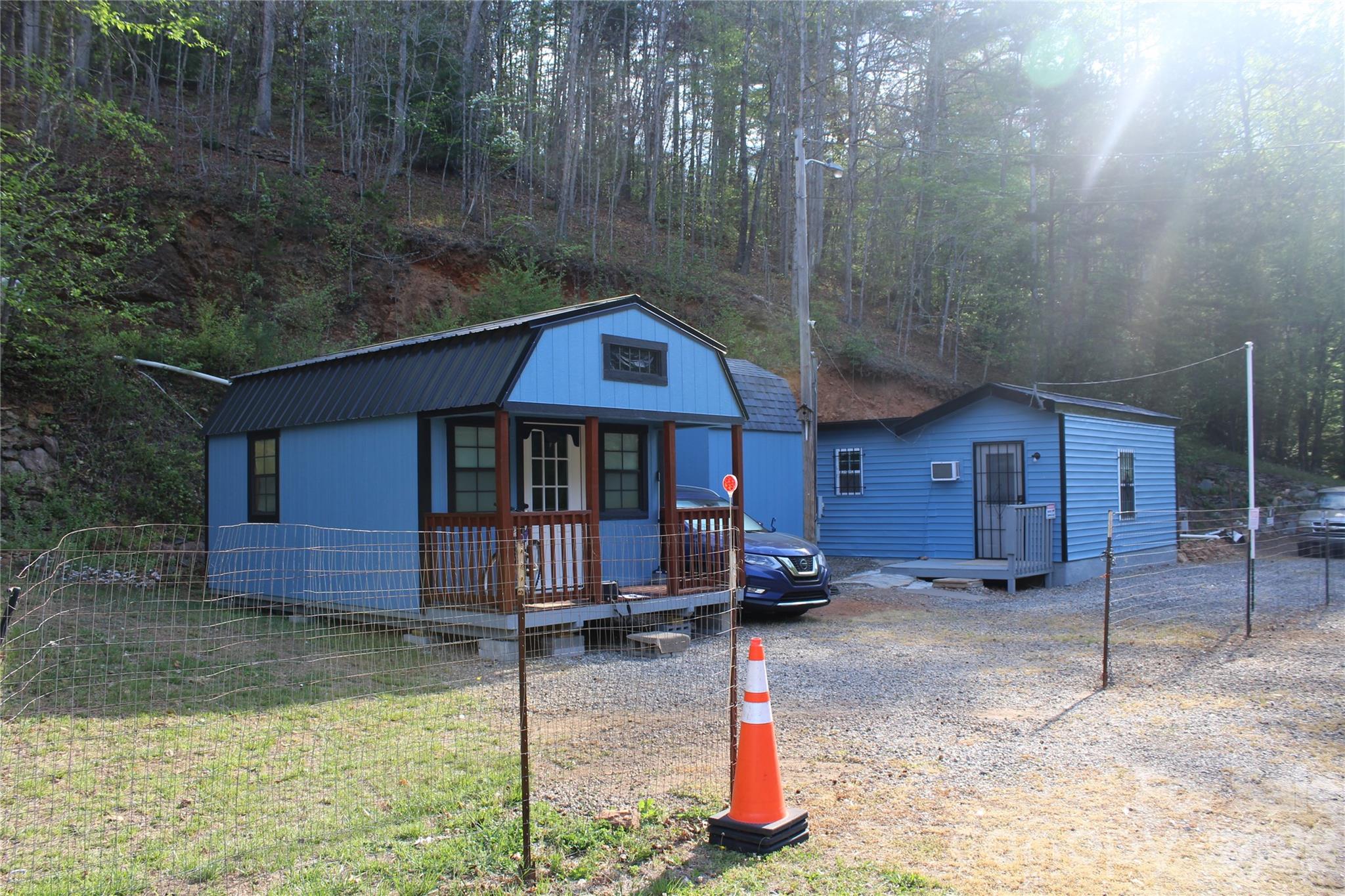 Don't miss out on the opportunity to make this unique lot on NC-18 yours! Zoned R-MU with approx. 250ft road frontage and 350sq ft office building this lot is the perfect place for a small roadside business! Whether it's an office, coffee shop, small-scale food service, nail salon or an arts/crafts studio this lot has the potential for it all! NCDOT reports 4,555 average annual daily traffic for this stretch of highway in 2025. Office building approx. 350sq ft with bathroom + shower on a 24" slab. 8x8 storage shed on property as well. Fifth wheel RV on property is connected to utilities and is included in the sale of property. City water on property available for hook up.