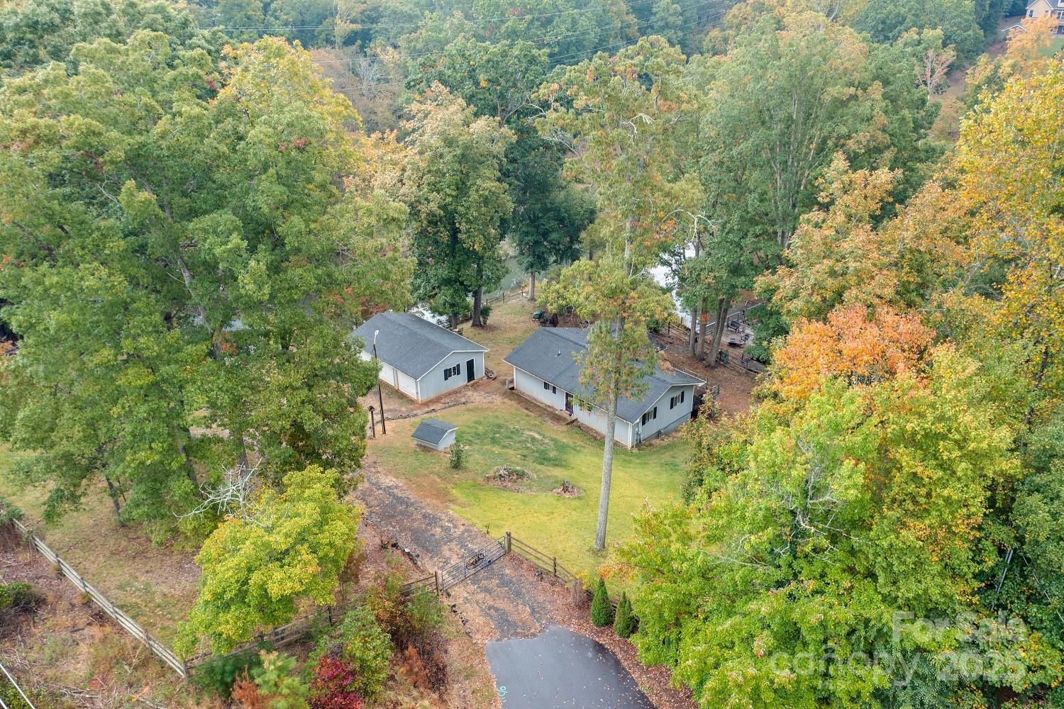 The bygone days and simpler times at the lake are calling.... along with a little hard work. Located just minutes to Charlotte's Premium Outlets, I-485, and just 15 minutes to Charlotte Douglas Airport this river cabin is ready for all those who love a little adventure. Whether it be kayaking down the shores of Lake Wylie or watching deer take a cool drink this could be your perfect lake getaway.  The permitted dock needs replacement and the deck/walkways on the home need to be replaced! (DO NOT WALK ON DECKS,WOODEND WALKWAYS,DOCK!)  County water already connected along with natural gas. Convenient updates like on demand water heater, gas fire place, and nicely updated kitchen await. Jet Ski lifts/docks in place along with boat lift. Its not the deepest of waterfront lots....it sure is private though and perfect for kayaks, paddle boards, fishing, and more! LISTING AGENT MUST BE PRESENT FOR ALL SHOWINGS!