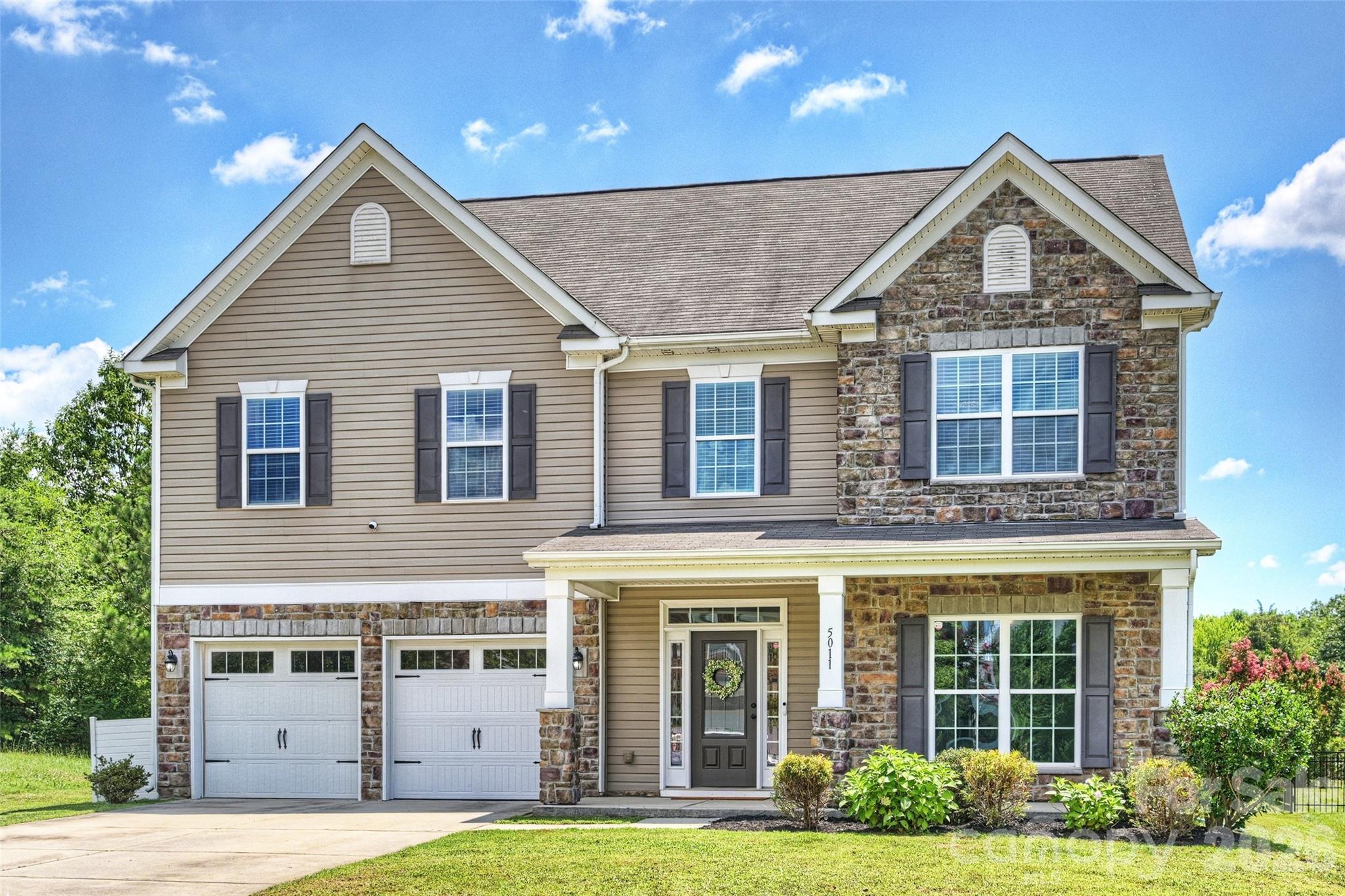 Welcome to this gorgeous and spacious 5-bedroom, 4.5-bath home nestled in the highly sought-after Berewick community! Beautifully maintained and filled with natural light, this exceptional home offers an open, functional floor plan designed for both everyday living and effortless entertaining. The main level features rich hardwood flooring, a private study/home office, a formal dining room, and an inviting great room that flows seamlessly into the well-appointed kitchen and casual dining area. Whether you're hosting gatherings or enjoying a quiet evening at home, this layout offers the perfect balance of comfort and style. Upstairs, you'll find a luxurious primary suite complete with a spa-like bath featuring an oversized walk-in shower, relaxing garden tub, and spacious walk-in closet. A rare second primary suite offers its own large walk-in shower and walk-in closet, making it ideal for multigenerational living or long-term guests. Two additional generously sized bedrooms and a full bath complete the second level. The third floor provides incredible versatility with a fifth bedroom, full bath, and an expansive loft, perfect as a media room, home gym, playroom, or private guest retreat. Additional highlights include neutral paint throughout and a HUGE covered rear patio overlooking mature trees and a peaceful pasture, creating the perfect outdoor space for relaxing or entertaining with endless possibilities. Residents of Berewick enjoy outstanding resort-style amenities, including three pools, a fitness center, clubhouse, playgrounds, sports courts, and scenic walking trails. Conveniently located just minutes from shopping, dining, Charlotte Premium Outlets, Carowinds, and major interstates, this home offers easy access to everything Charlotte has to offer.