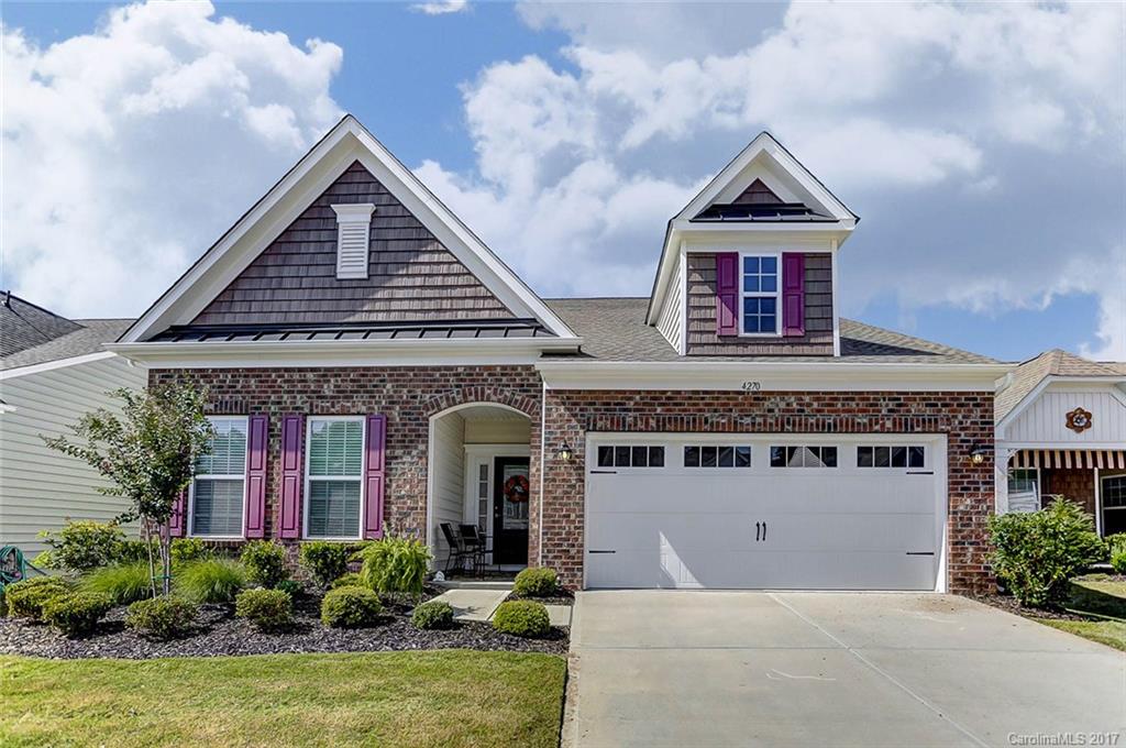 Welcome to Your New Home in Carolina Reserve w/ Resort-Like Amenities! Enter to Wood Floors, Crown Molding, Formal DR, Great Room w/ Gas Fireplace, Gourmet Kitchen w/ Expansive Granite Island, SS Appliances, Staggered Cabinetry, Breakfast Area w/ Access to Paver Patio w/ Built-In Grill & Irrigation, Owner's Suite w/ Sitting Area w/ Access to Screened Room, Owner's Bath w/ Double Vanities, Tiled Shower w/ Seat, Walk-In Closet, 2 Add'l BRs & Full Bath--Upper w/ Bonus Room, BR w/ Walk-In, Full Bath