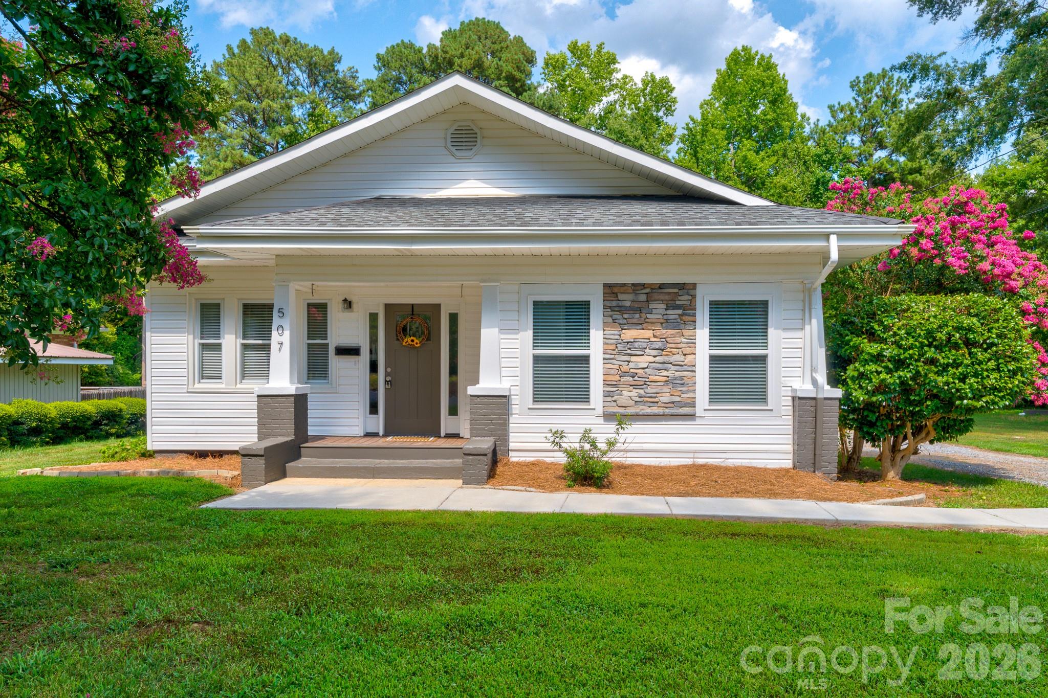Welcome home to this completely renovated cottage-style charmer, conveniently located just minutes from downtown Cherryville! Blending timeless character with modern updates, this move-in-ready home offers spacious living with large, inviting rooms and an open-concept kitchen and dining area that's perfect for everyday living and entertaining.

The stunning kitchen features a large center island with gorgeous granite countertops, abundant workspace, and a seamless flow into the dining area. Natural light pours through the home's many windows, highlighting the beautiful neutral paint colors and creating a bright, warm atmosphere throughout.

The spacious bathroom is a true retreat with a luxurious soaking tub, while the second full bathroom features a beautifully tiled walk-in shower. Every detail of this renovation has been thoughtfully completed, offering style, comfort, and functionality.

If you're looking for a home that combines cottage charm with modern finishes in a convenient location near downtown Cherryville, this one is a must-see!