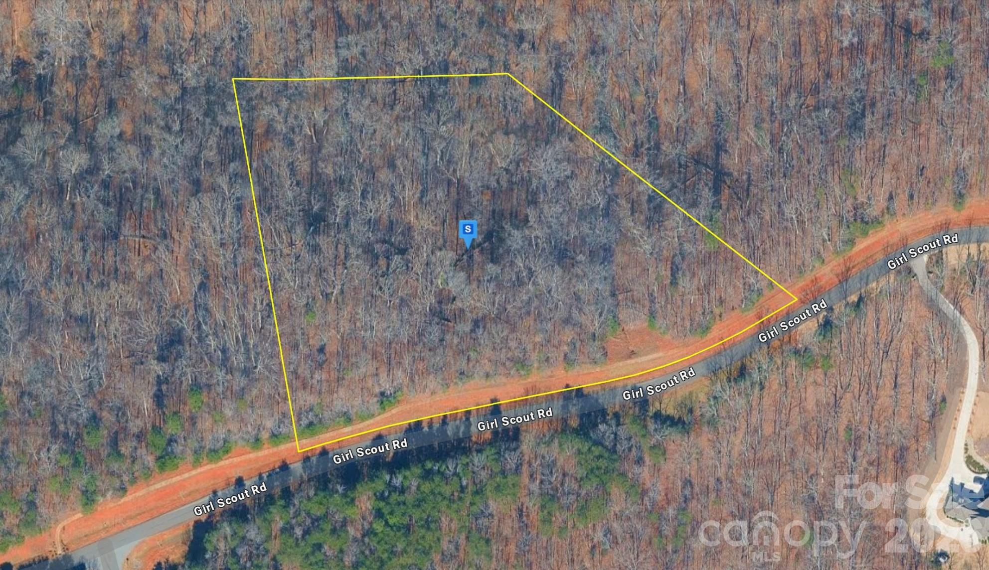 Discover this beautiful 4.83-acre lot in the Charlotte area of Mecklenburg County! Located within an HOA community near Catawba Creek, this property features sloped, wooded terrain that offers privacy, natural scenery, and an ideal setting for a custom-built home. Enjoy access to an incredible waterfront community with resort-style amenities including a waterfront camp area, pool, lake access, walking trails, lodge, tennis courts, and kayak/canoe access. Public water and sewer are available per seller, adding convenience for future development. Experience peaceful surroundings with a scenic natural setting while remaining close to shopping, dining, entertainment, and everything the Charlotte area has to offer. Listing is for land only and comes As Is.