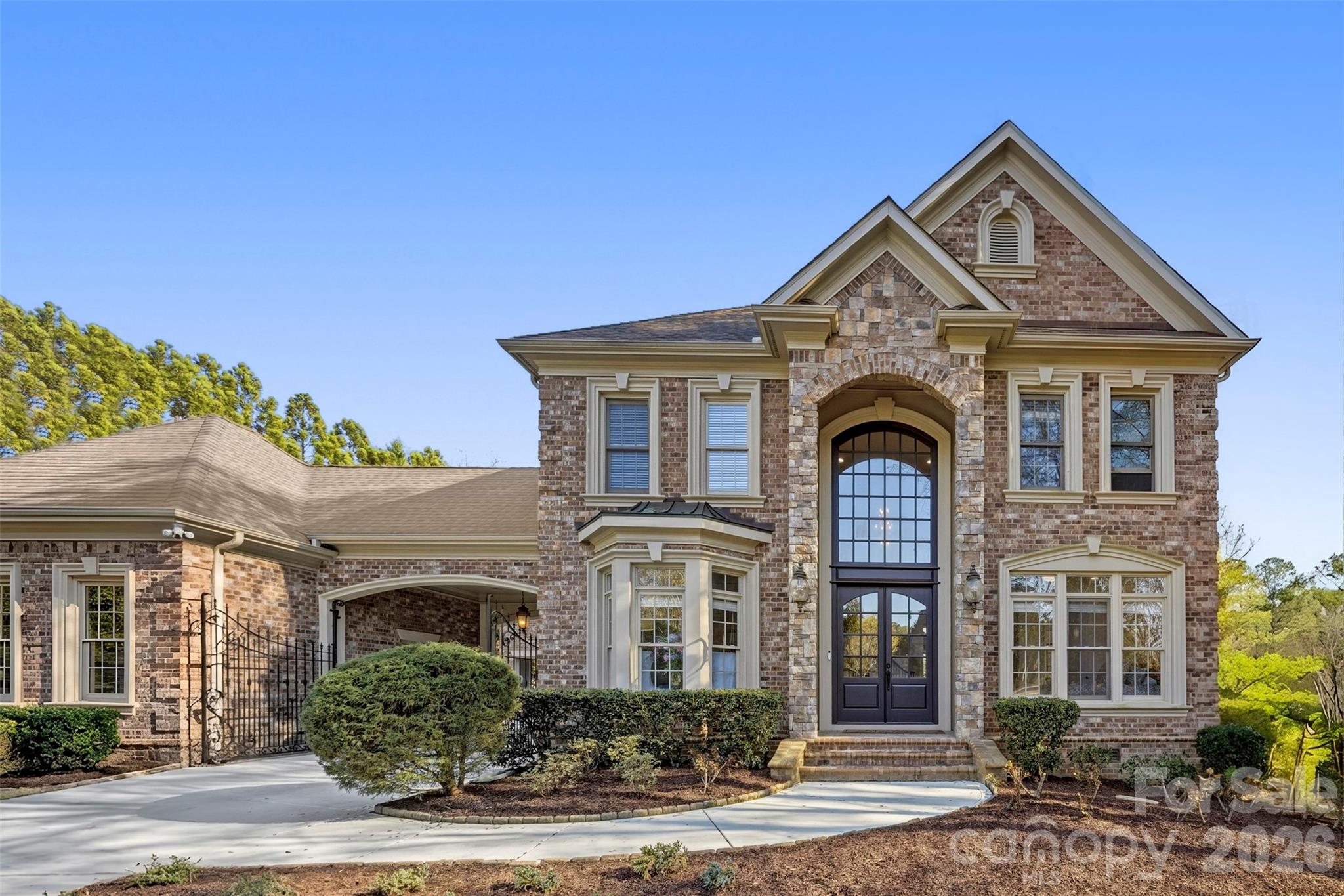 Experience luxury living at its finest in this exceptional 5-bedroom, 5.5-bathroom estate with a 4-car garage, offering over 5,800 square feet of thoughtfully designed living space in the highly sought-after Providence Downs South community of Waxhaw. This smart home features app-enabled lighting for seamless control from anywhere. The highly desirable floor plan includes a spacious primary suite on the main level, along with a guest bedroom and full bath, providing flexibility for multigenerational living or overnight guests. The beautifully updated chef's kitchen is the heart of the home, featuring a side-by-side refrigerator, gas range, double islands, abundant cabinetry, and generous gathering space. Every bathroom in the home has been newly renovated, offering modern finishes and elevated style throughout. Upstairs, you'll find oversized secondary bedrooms and two expansive bonus/recreation rooms with brand-new carpet, ideal for a media room, home gym, playroom, or additional living space.
Step outside to your private backyard retreat featuring a heated pool and spa, pool house with a full bathroom and flex room, outdoor fireplace, and a retractable screened porch installed in 2024 that seamlessly blends indoor and outdoor living. A courtyard basketball area provides even more opportunities for recreation and entertainment.
Located within a top-rated school district, Providence Downs South residents enjoy access to resort-style amenities including a clubhouse, swimming pool, tennis courts, and pickleball courts.