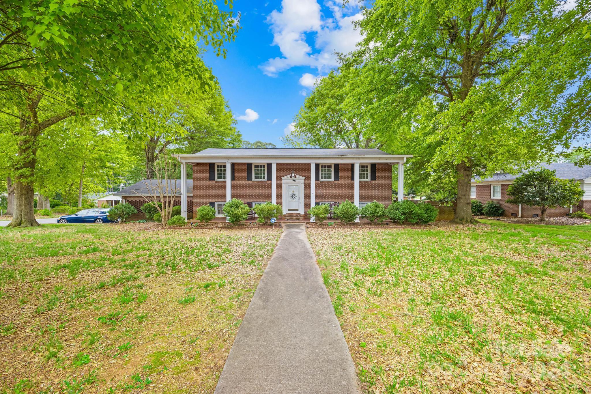 Discover the perfect blend of the comfort and convenience in this charming split foyer brick home, ideally located on a corner lot near shopping centers,the hospital, restaurants,I-85 for easy commuting,and great schools.This spacious residence offers a fantastic layout and plenty  for customization.Enjoy the generous living space upstairs designed for entertaining or relaxation.The primary bedroom suite is located on the upper floor for added privacy.The functional lower level includes a fully - equipped kitchen ,breakfast area,full bath, laundry room, and a guess bedroom.Experience  year- round comfort in the bright and airy sunroom off the rear  of the home,which looks out over a private year yard surrounded by a brick privacy fence. The double garage enters from the side making accessing the home a breeze.This home is priced to allow for any updates or upgrades you desire,making  it
 easy to create your dream home.