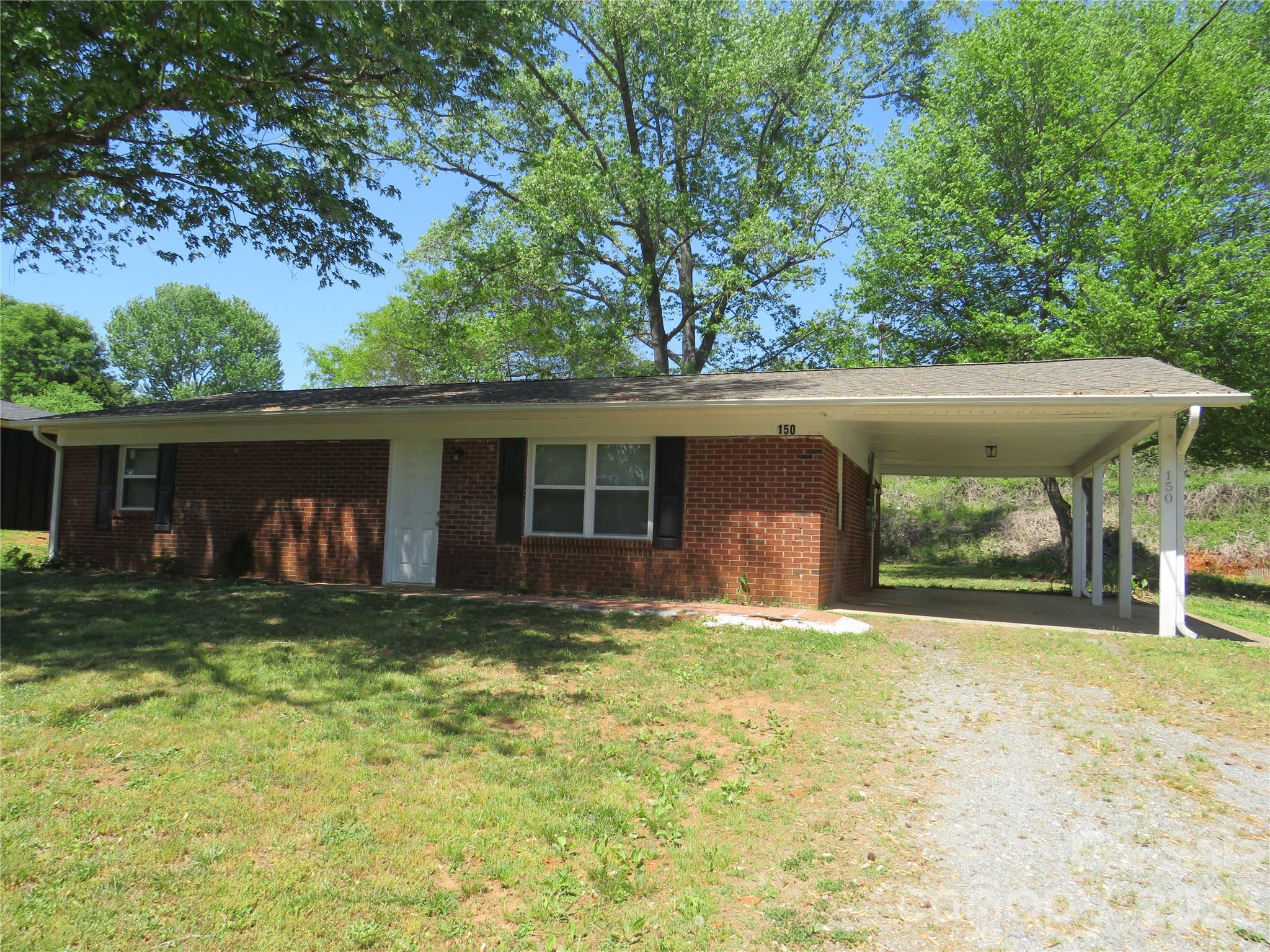 Cute brick ranch with many updates in 2023 which include new luxury vinyl plank flooring throughout, new windows, new exterior doors, new interior doors, tiled tub surround, new roof, new HVAC system. Nice large open living room. Appliances convey. Attached carport. Just one mile from historic downtown Forest City and convenient to shopping and easy access to Hwy. 74A.