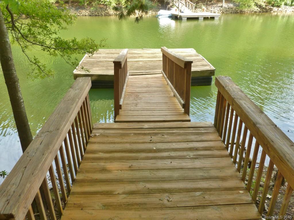 Awesome water view property with private deeded dock. Great views of the lake! Home offers vaulted ceiling in great room, open floor plan, screened porch, 2-car garage. Location, location! Gated waterfront community with club, tennis, golf, marina, walking trails and more!!!