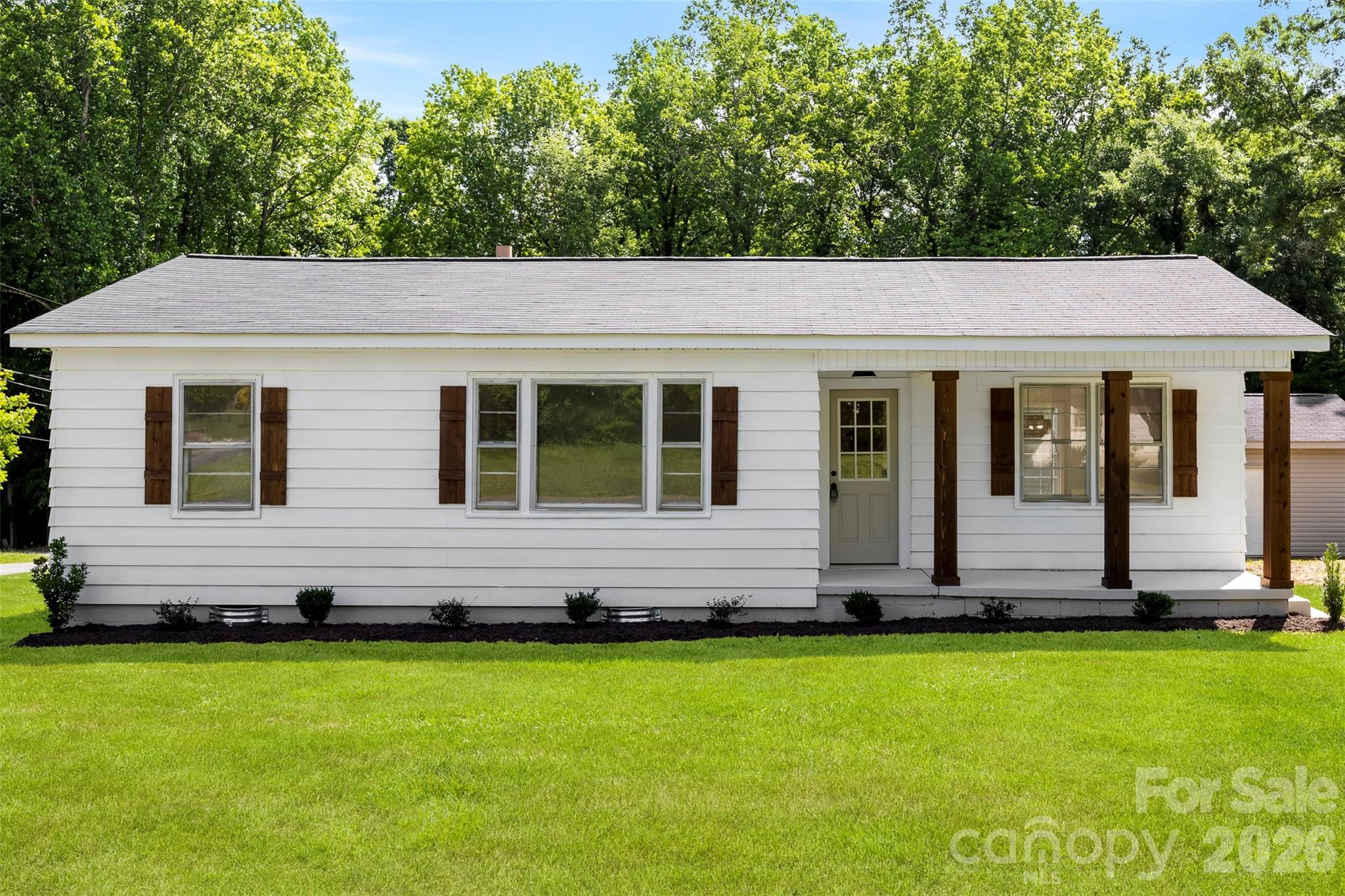 Charming & Cozy Classic in the Heart of Lowell.
Discover the perfect blend of comfort and convenience in this delightful 3-bedroom, 1-bathroom single-family home located in a quiet, established neighborhood. Whether you are a first-time homebuyer, looking to downsize, or seeking a smart addition to your investment portfolio, this home offers incredible value and potential. A functional, well-designed 965 sq. ft. floor plan that maximizes every inch of space. Filled with natural light, this home provides a warm and welcoming atmosphere from the moment you step through the door. Situated on a generous 0.35-acre lot, providing ample room for gardening, outdoor entertaining, or potential future expansion. Quiet location with excellent accessibility to I-85, shopping, and dining in both Lowell and Gastonia. Ideally located for easy living, you are minutes away from local amenities, parks, and schools, with convenient access to major thoroughfares for a stress-free commute to Gastonia or Uptown Charlotte. This property is a rare find in the current market, offering a peaceful residential setting without sacrificing accessibility. Don’t miss your chance to own a piece of Lowell—schedule your private showing today and imagine the possibilities! PLEASE NOTE: The detached garage does not convey with the home. The property has been resurveyed, and the detached garage is officially excluded from the parcel being sold.
