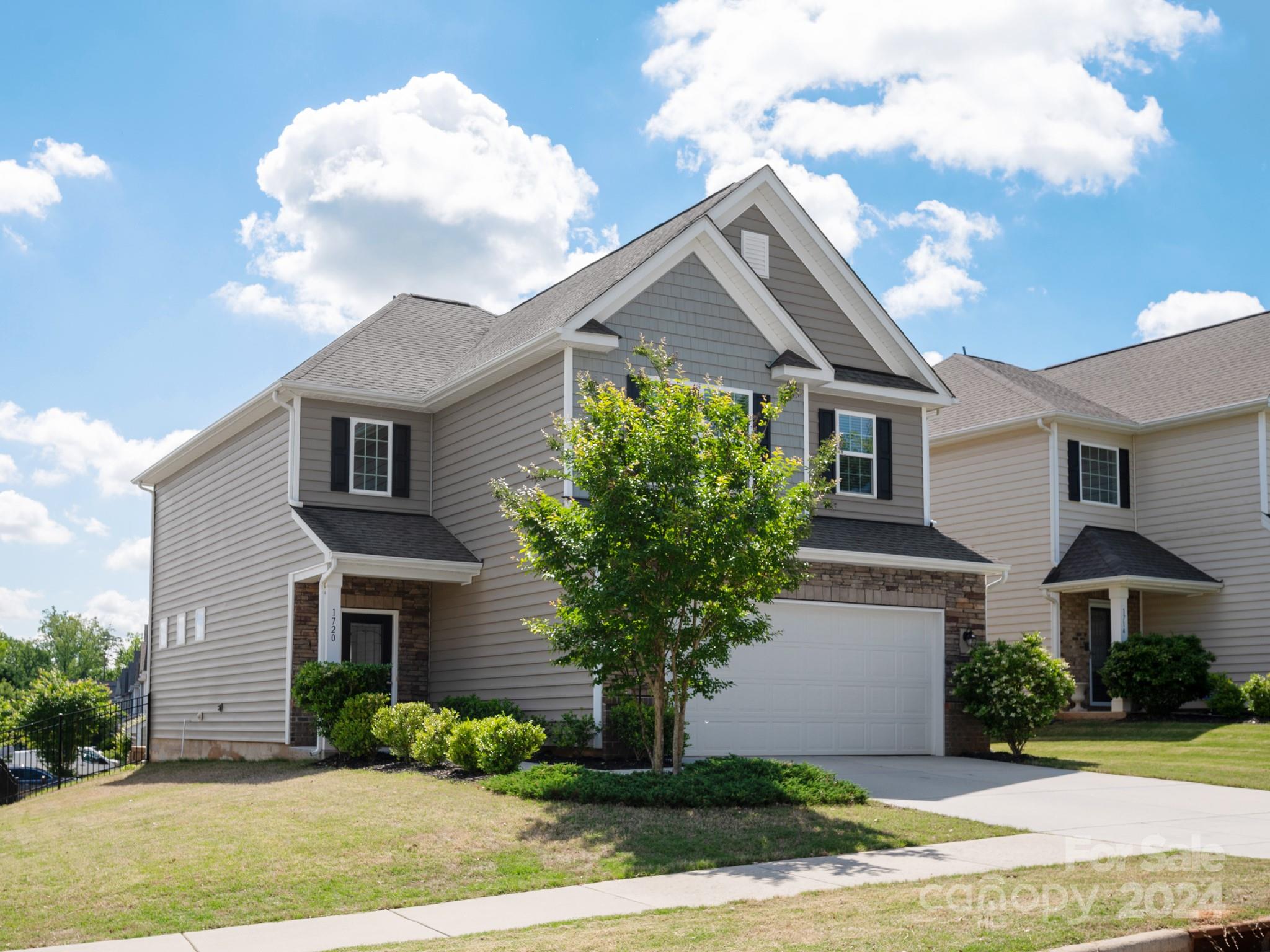 Multiple Offers Received! All offers due by 9:30am Sunday May 5th. Welcome to Waterside at the Catawba! An amenity rich community in the award winning Fort Mill School District! This stunning corner lot home is MOVE IN ready with updated light fixtures and fresh paint throughout the entire home! Light and bright kitchen features white cabinets, granite countertops, subway tile backsplash, and large island for an enjoyable cooking/dining experience. Hardwood floors throughout the entire first floor and convenient laundry room off the kitchen.  Open wrought iron stair rails lead to a large recreational room with multiple uses, two secondary bedrooms and full bath. Spacious owner's suite with TWO closets, soaking tub, separate shower, and dual sinks. Large CORNER LOT is fully fenced with a patio and plenty of space to play, grill, and enjoy the open air! Community amenities include a clubhouse, pool, tennis courts, fitness center, playground, and walking trails!