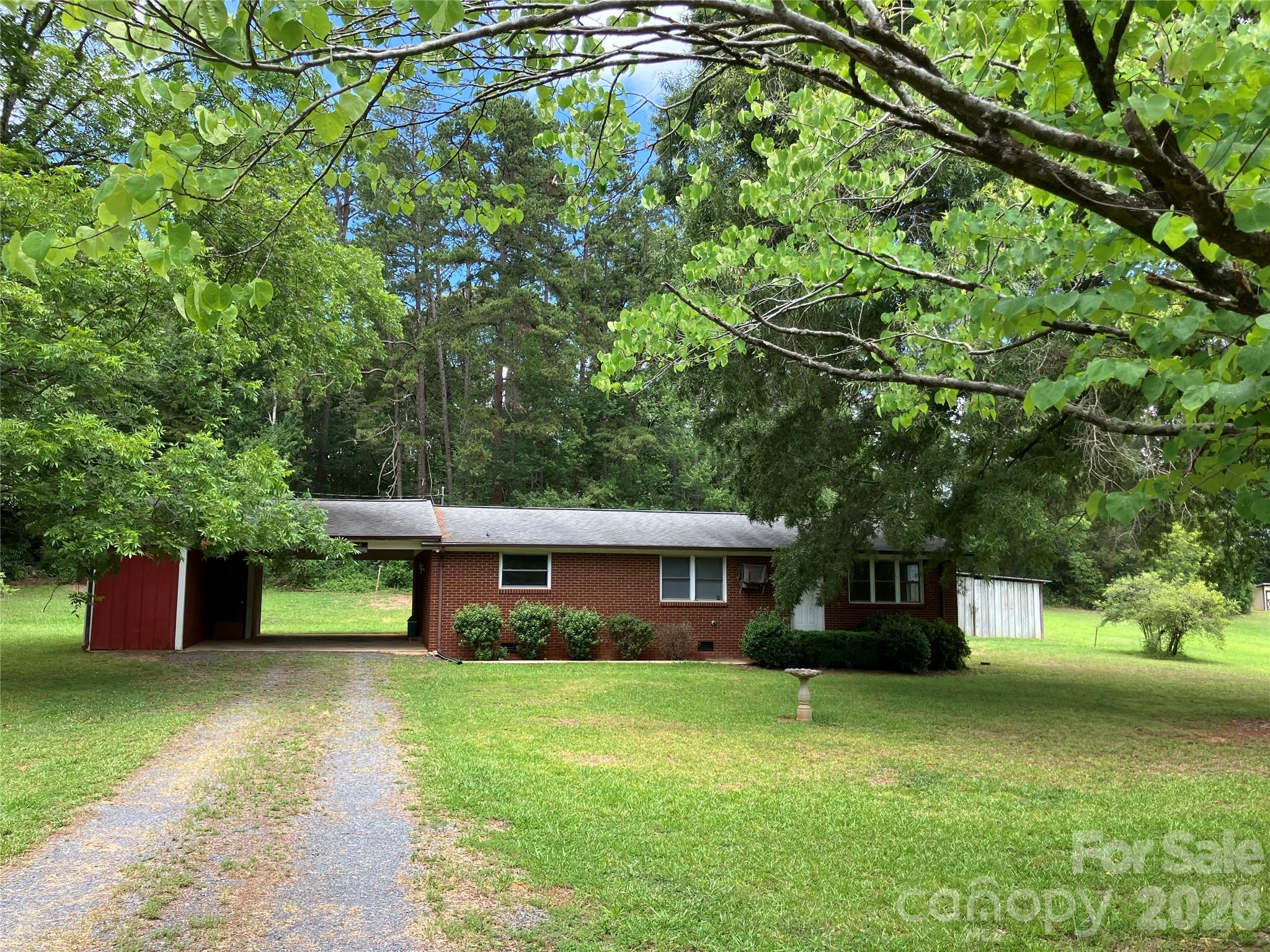 Beautiful home site in Stanfield North Carolina. Full brick veneer home. In need of remodel but great bones. Just a little over an acre of land, which will be separated from a larger parcel. Big, beautiful oak trees, blueberry bushes and grapevine. Nice private setting. Great starter home to make your own. Sold as is.