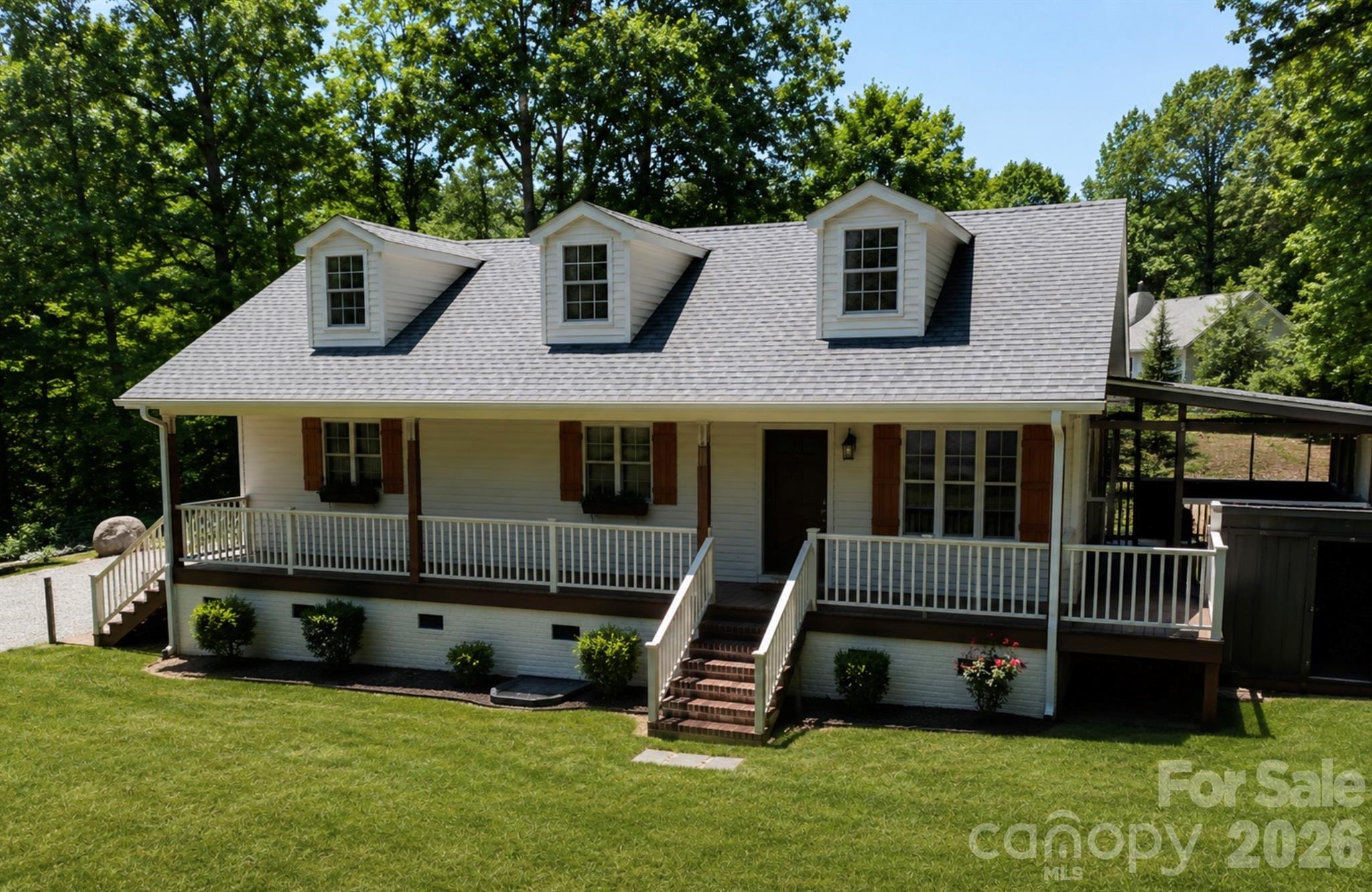 Beautifully updated home in the heart of Sherrills Ford, ideally situated on a quiet dead-end road with minimal traffic and peaceful views of Lake Norman. Positioned on a level half-acre lot, this property offers an exceptional blend of privacy, functionality, and modern smart-home living. The home features approximately 1,731 square feet of total "living" area, including a recently remodeled upper-level space offering 573 square feet of heated and cooled flex space. While the upper level is fully finished and climate controlled, portions of the area feature ceiling heights slightly less than 7 feet, preventing it from being included in the home’s official heated square footage calculation. The space still feels open and comfortable even with 6'9" ceiling.
Both the front and backyard are fully fenced, while the additional e-collar system offers added peace of mind for pet owners. Enjoy mornings on the expansive covered front porch overlooking the lake or relax year-round on the screened porch surrounded by the serene setting. The level yard provides outstanding usable outdoor space and an ideal setting for entertaining, pets, or everyday living.

The entire home is equipped with a full Lutron Caseta automated lighting system, along with automatic shades, cameras, thermostats, and a complete alarm system—all seamlessly controlled through digital video keypads or directly from your phone. The spacious open kitchen features quartzite countertops, pull-out cabinet shelving, an under-counter beverage refrigerator, and premium appliances including a brand-new refrigerator, plus washer and dryer that all remain with the home. Both bathrooms have been extensively remodeled with custom tiled walk-in showers and frameless glass doors, while the primary suite includes a custom-built closet organization system.

Major system upgrades completed in 2021 include a new HVAC system with all-new ductwork, a new water heater, and a whole-house water filtration and softening system. Additional highlights include LVP flooring, picture-frame trim accents, and an incredible 9.1 Dolby Atmos surround sound entertainment system with an 85-inch television valued at over $10,000, which conveys with an acceptable full-price offer. No HOA.