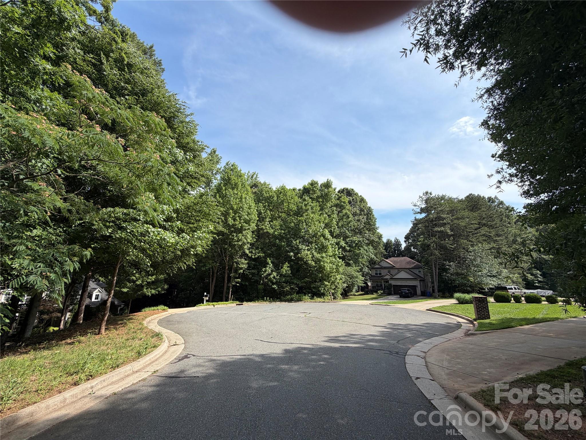 Looking for a rare Mooresville lot to build your perfect dream home in one of Mooresville most established neighborhoods?  HERE IT IS!! Featuring .59 of acreage.(WOW!) This wooded lot is located in the Cul-de-sac at the end of Colony Hill Lane. Great location close to restaurants, shopping and much more. Located in the sought after Mooresville Graded School District. Come take a look at this wonderful property for your dream home. Our preferred builder can give a buyer very competitive estimates and plans for a new home.