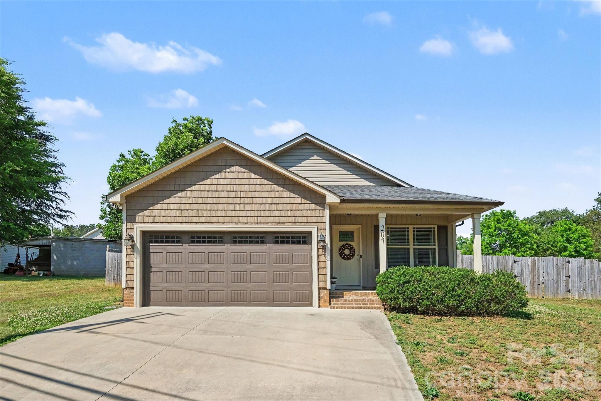 Welcome to 207 Kimball Road — a beautifully maintained ranch-style home built in 2019 that feels practically new. This thoughtfully designed ranch offers an open concept layout featuring durable plank flooring throughout the main living areas, granite countertops, stainless steel appliances, and modern finishes. The spacious kitchen includes a large center island, abundant cabinetry, and flows seamlessly into the dining and living areas, creating an inviting space for both everyday living and entertaining.

The spacious primary suite includes a walk-in closet and dual vanity bath, while the split-bedroom floorplan offers privacy with two additional bedrooms providing flexibility for guests, a home office, hobbies, or workout space. Additional highlights include a 2-car garage, a large privacy fenced in back yard, laminate wood flooring and tile throughout with no carpet, modern systems, and move-in ready condition.  This is a rare opportunity to own a newer home with a true “like-new” feel.

Conveniently located near restaurants, grocery stores, parks, and everyday conveniences, with nearby access to Warrior Golf Club and I-85 for an easy commute to shopping and vibrant downtown experiences in Kannapolis, Concord, Mooresville, and Charlotte.