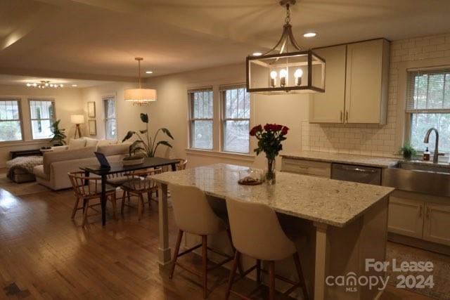 Fully Updated 1930's Home close in to Uptown. Hugh Front and rear Porches, and Hardwood floors, 3 Bedrooms and 3 Full Baths, Fantastic Kitchen Like no other includes Stainless Appliances and Large island great for Entertaining, Main Bedroom is like a Suite with Superb Bathroom with Separate Stand alone Tub and Glass Shower Double Vanieties, and spacious Walk-in Closet. Upstairs has loft with Exposed Rough Sawn joists, Two bedrooms, Walk-in Closets, and Double Vanity Full bath. Just a couple minutes to Uptown, Airport, Resturants, and great Shopping.