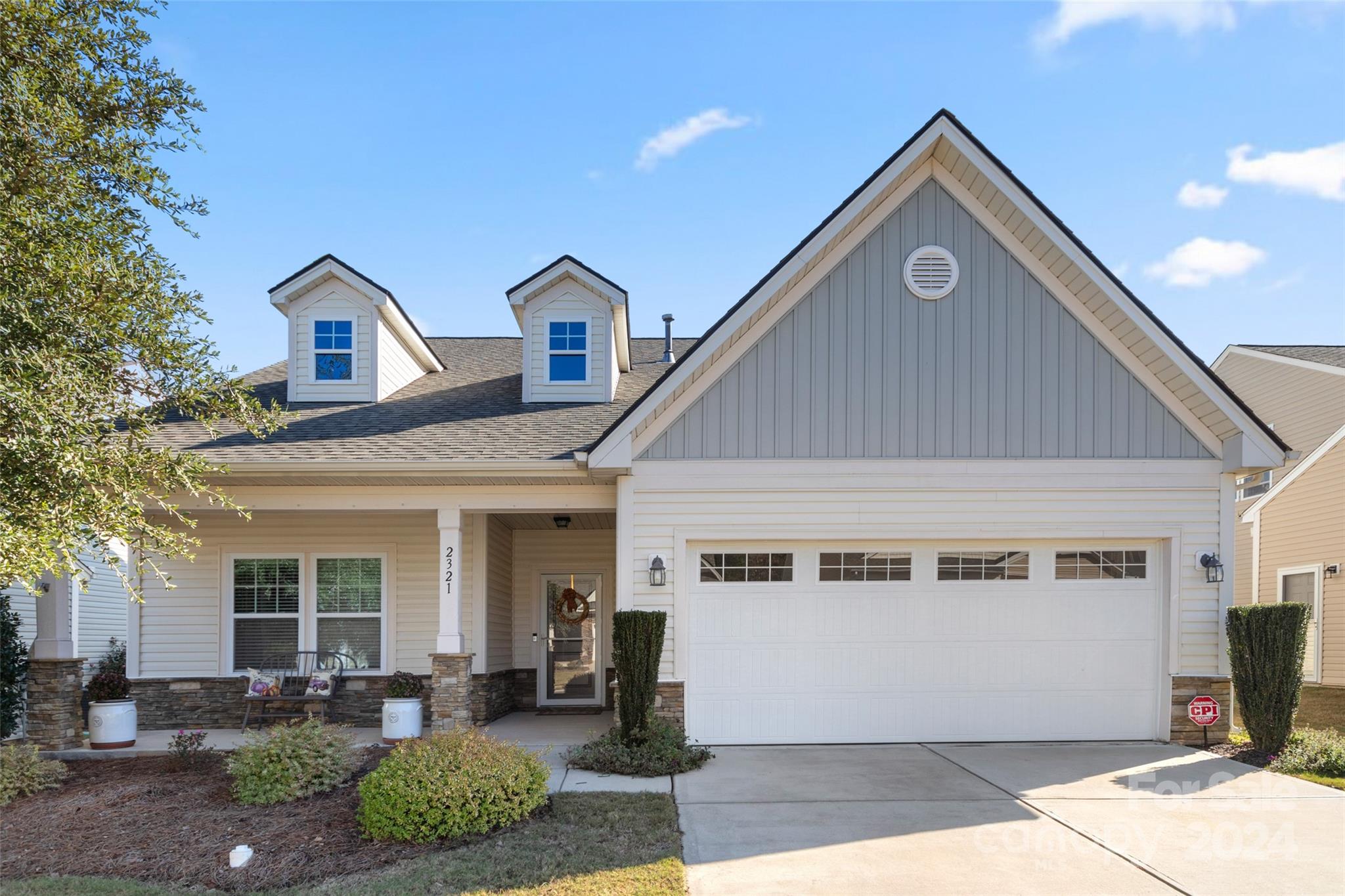 BACK ON THE MARKET! Looking for low maintenance living in an amenity rich community? Look no more. Enjoy this spacious 1.5 story home that on the main level features an open floor plan, gourmet kitchen and a primary bedroom with a charming sitting room, another bedroom and full bathroom creating a comfortable living space.  A screened in porched provides you a gracious way to start and end your day overlooking  a private, beautifully landscaped backyard.  On the upper level, you have a large bonus room for game nights, big screen watching, etc.  A third bedroom and bathroom make the second floor living a dream for family and friends!  The 2 car garage has built in cabinets and a workspace suitable for woodworking, etc..  Lawn maintenance is included in your HOA along with access to the community pool, amenity center, and tennis courts.  Living in Tega Cay gives you lake access via the marina and local boat launches, walking paths, pickleball courts, golf course, and so much more.