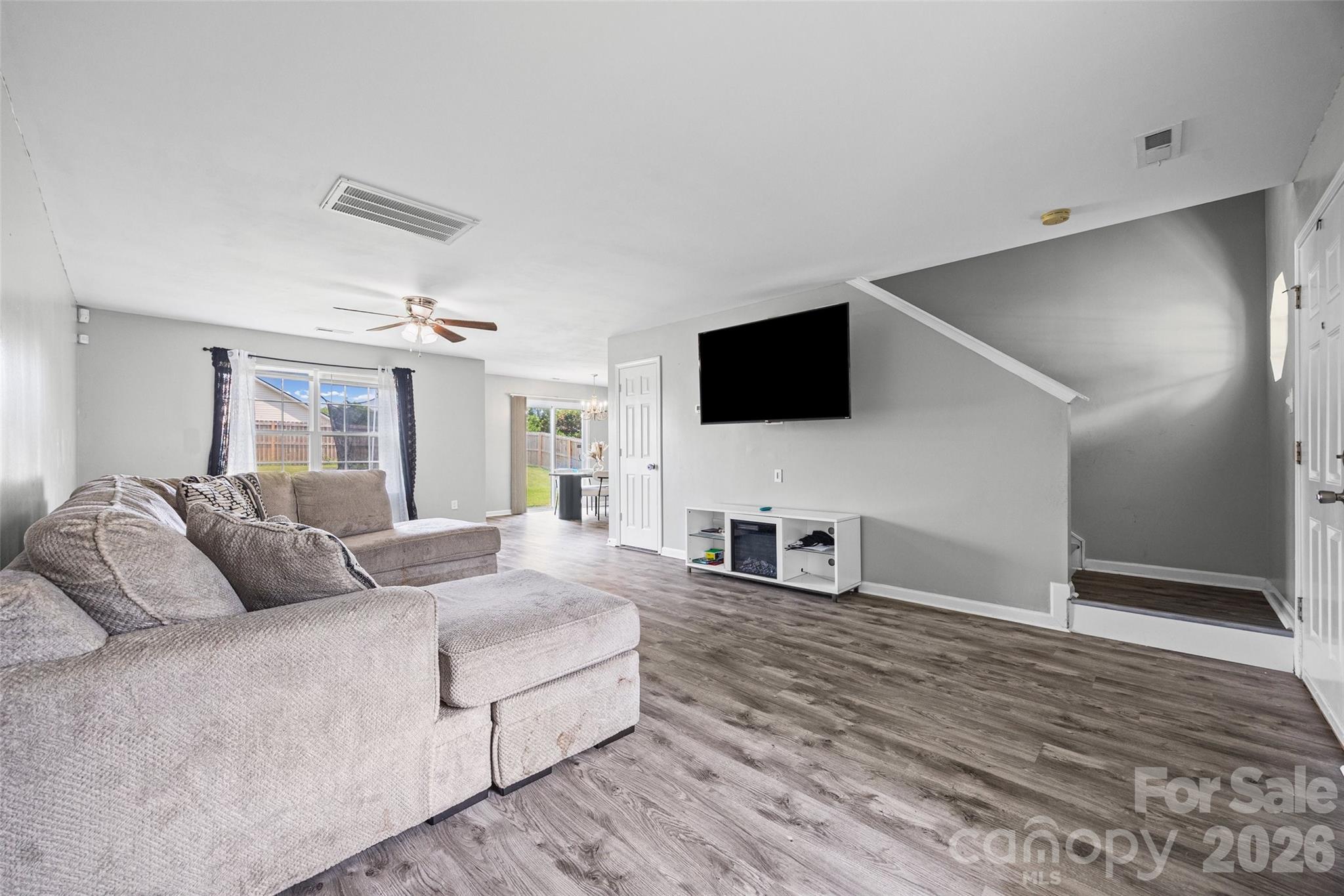 Stop compromising on square footage and move up to more space at a price that can't be beat!  Nestled in Soft Winds Village, this home offers almost 2000 square feet at an unbeatable value.  Priced well below tax assessment, this home delivers instant equity and room to grow.  The main level features a bright, welcoming family room with new LVP that flows effortlessly into the dining area and kitchen with all appliances included.  Upstairs, you will discover the ultimate space to relax and unwind at the end of the day, featuring a massive primary suite, lounge area, soaker tub, separate shower, and walk-in closet.  Kick back in the spacious loft area for a game or movie night.  The laundry room with washer and dryer is also upstairs and is large enough to be closed off so laundry day has never been easier.  HVAC system was replaced just last year to keep you cool on the hottest summer days. Situated on a flat lot with fully fenced yard as well as a two car garage, this is the home you have been looking for.