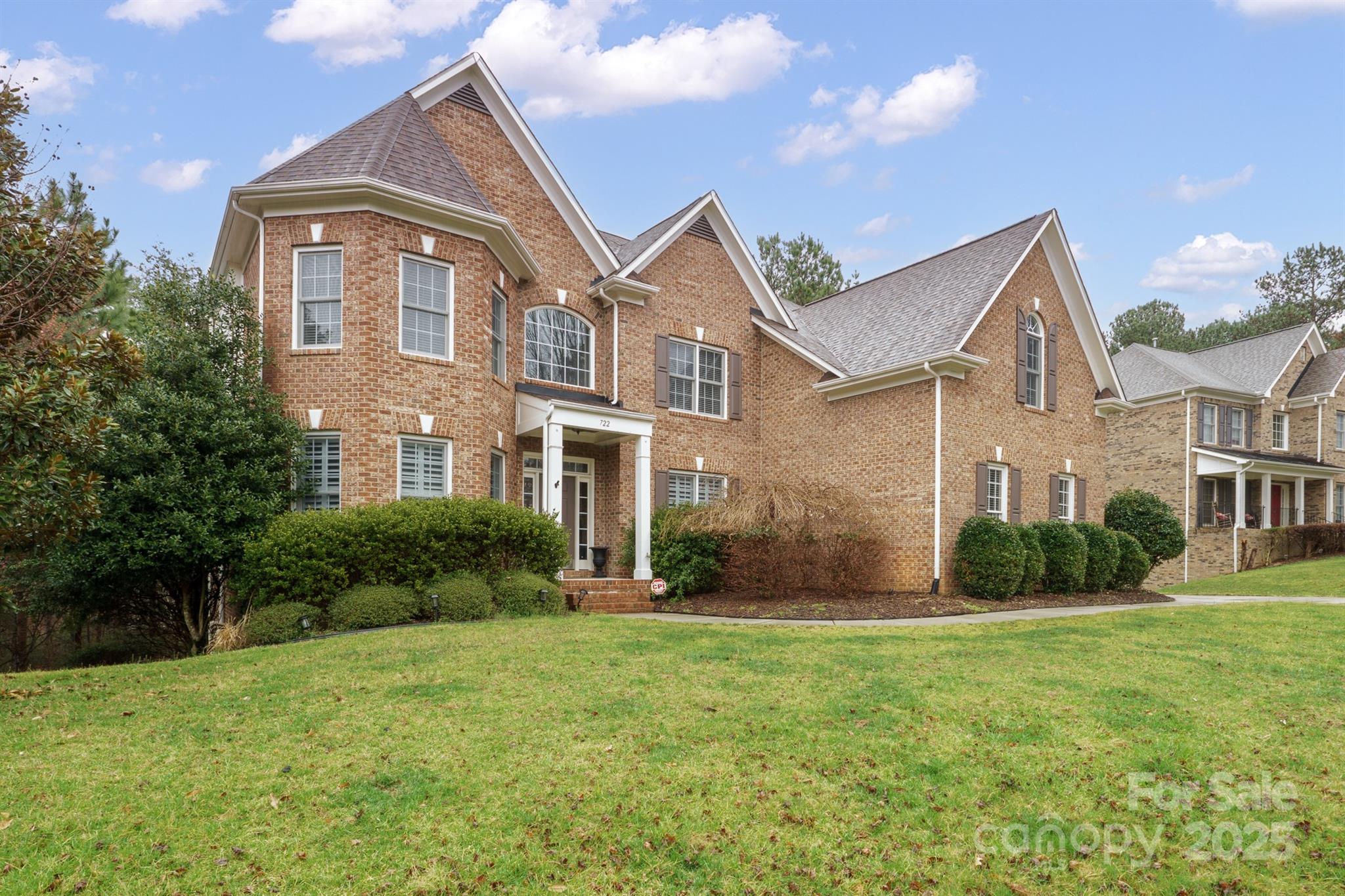 This stunning 2-story brick basement home offers 5 bedrooms, 4.5 baths, and nearly 5,000 sq ft of elegant and meticulously maintained living space with premium upgrades. Nestled in the desirable Lakeshore community on the Tega Cay peninsula with top-rated Tega Cay/Fort Mill schools. A two-story family room is bathed in natural light from a dramatic wall of windows. The chef’s kitchen boasts custom floor-to-ceiling cabinetry, quartzite counters, a 36” six-burner gas range with pot filler, dual dishwashers, a built-in oven/microwave combo, a second sink, a 42” built-in fridge, a mosaic marble backsplash, a walk-in pantry, and a spacious island with a wine fridge. Step out from the breakfast area to two half-decks overlooking a private, tree-filled, fenced yard. The primary bedroom boasts a spacious bathroom and an oversized closet with laundry. Tega Cay residents have the option to join Tega Cay Golf Club, with access to the golf course, tennis courts, and all club facilities.