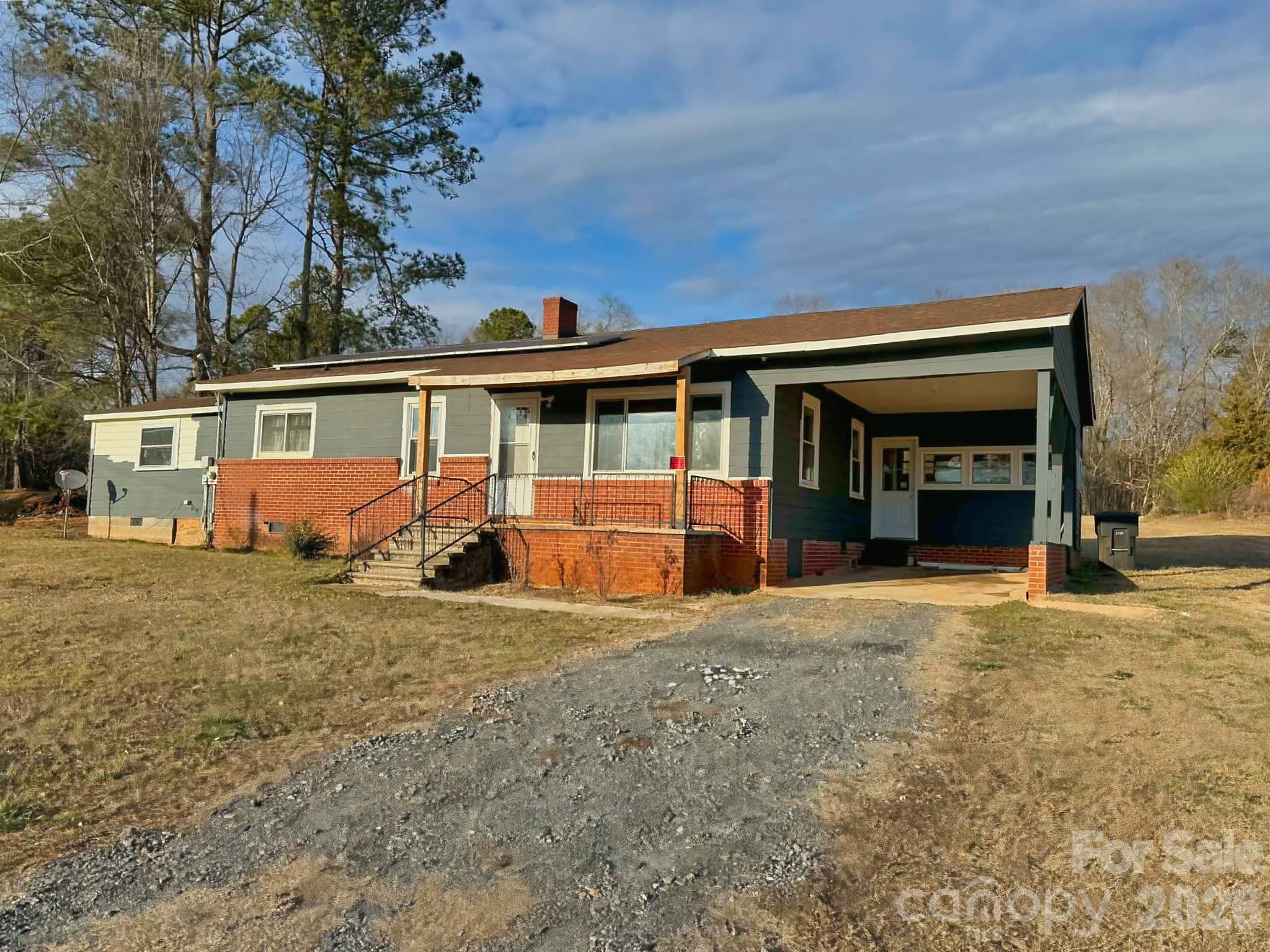VERSATILE HOME WITH GARAGE BUILDING AND MULTIPLE PARCELS - This charming three-bedroom, one-bath home offers comfort, flexibility, and room to grow. Hardwood floors run through much of the home, adding warmth and character. The third bedroom leads to an enclosed porch—perfect for relaxing year-round. The attached carport adds everyday convenience. Ideal for a home-based business, hobbies, or storage needs, the property includes a large concrete block garage building. Situated on two parcels totaling just under two acres, the land provides space to spread out with potential for additional home sites (buyer to verify).
Whether you’re looking for a primary residence with room for expansion, a hobby property, or an investment opportunity, this property offers rare versatility and value.