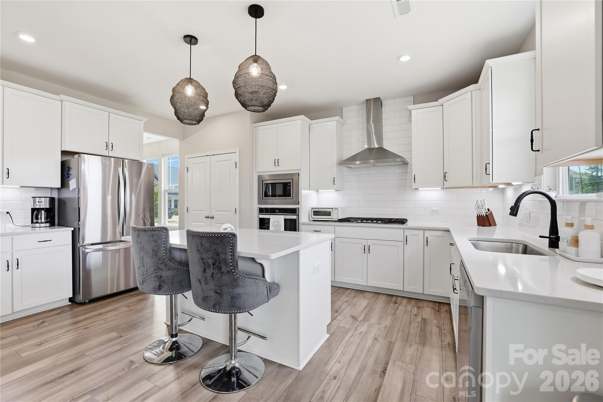 Welcome to this very rare find! A well-maintained Dan Ryan Drayton floor plan offering 4 bedrooms and 3 full bathrooms in the highly sought-after MillBridge community. Designed with everyday living in mind, this home features an open-concept layout filled with natural light and thoughtful finishes throughout.

The main level includes a guest bedroom and full bathroom, providing flexibility for visitors, multi-generational living, or a home office. The gourmet kitchen with the expansive center island overlooks the living and dining areas, creating a seamless flow for daily living and entertaining.

Upstairs, a versatile loft offers additional living space that can be adapted to fit your needs. The generously sized primary suite with a custom closet is complemented by secondary bedrooms that are generously sized to accommodate all kinds of furnishings.

An oversized garage provides additional storage and functionality, while the backyard offers an opportunity to create your ideal outdoor living space. Conveniently located near community amenities, shopping, dining, and major commuting routes, this move-in-ready home combines space, flexibility, and convenience in one attractive package.