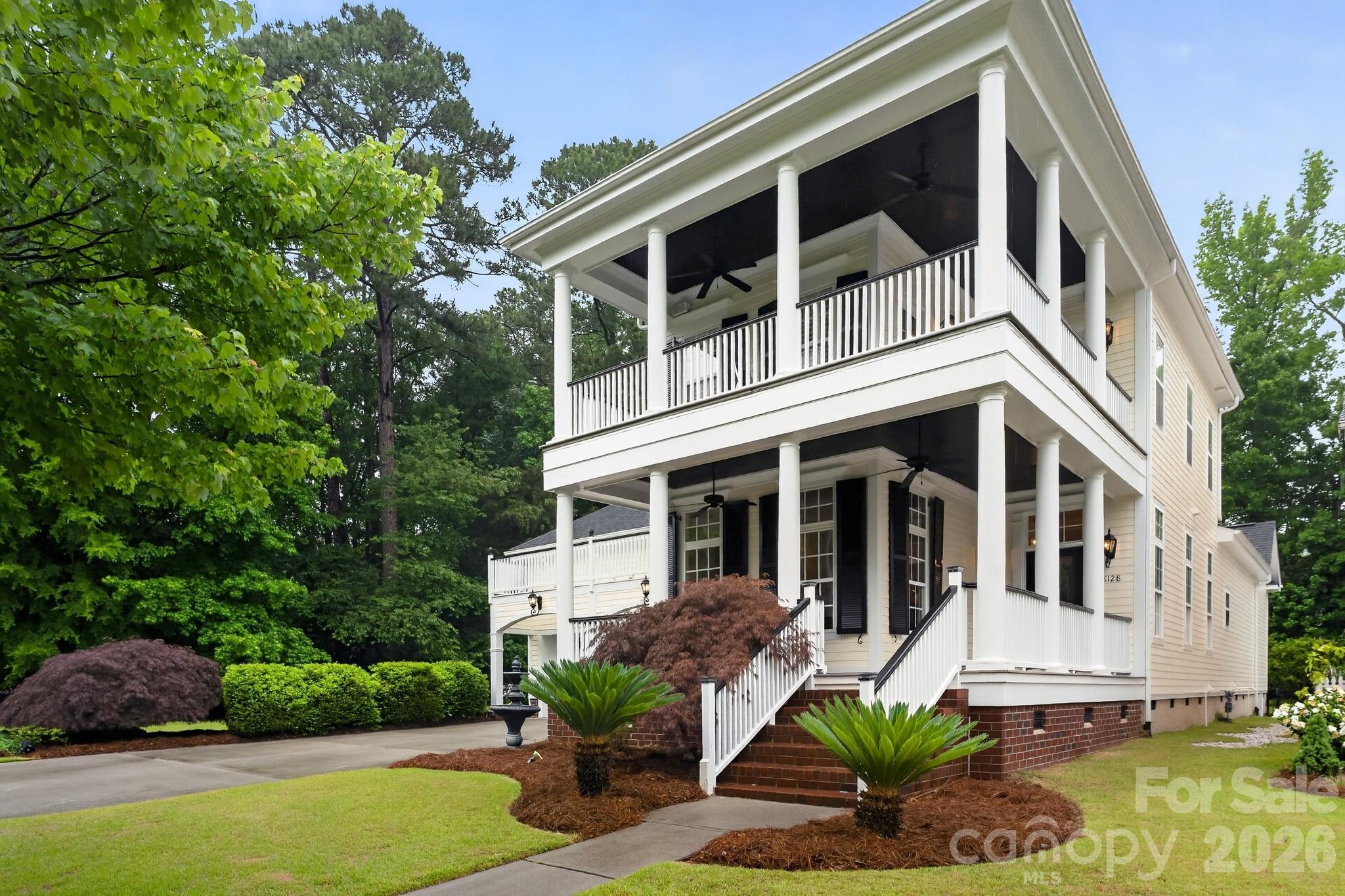 Experience the timeless elegance of Charleston Style living in this beautifully maintained home in the heart of Ballantyne , ideally situated on a premium interior end lot adjacent to a wooded greenbelt. One of the home's most distinctive features is its rare sense of privacy, with tranquil tree lined views that create a peaceful, private retreat rarely found in a community setting. The well designed floor plan features a main floor primary suite.and spacious living areas. Freshly painted , exterior and interior , this move-in ready home offers numerous major updates, including a newer roof, updated HVAC systems, new water heater, new gas cooktop, new dishwasher, and new carpeting throughout the upstairs. Hardwood flooring extends throughout the main living areas on the first floor, including the main level primary bedroom, while plantation shutters and extensive 12" crown molding , and chair molding add warmth, character, and timeless appeal. Outdoor living is exceptional. Enjoy the welcoming Charleston-style porches, new composite upper and lower decks, and a screened sunroom enhanced with floor to ceiling EZ Breeze windows. Surrounded by mature trees and greenbelt views, this space offers a level of privacy and natural beauty that is increasingly difficult to find. The garage has been freshly repainted and upgraded with a durable epoxy floor, creating a clean and polished finish. With major systems already updated, classic Charleston architecture, abundant outdoor living spaces, and one of the neighborhood's most private homesites, this home presents a rare opportunity to enjoy Southern Charm , comfort, and peaceful surroundings in an established community in the Ardey/Ballantyne area. Living in Ardrey means enjoying one of South Charlotte's most coveted communities, complete with clubhouse, fitness center, resort-style pool, playground, dog park, bocce courts, and more.