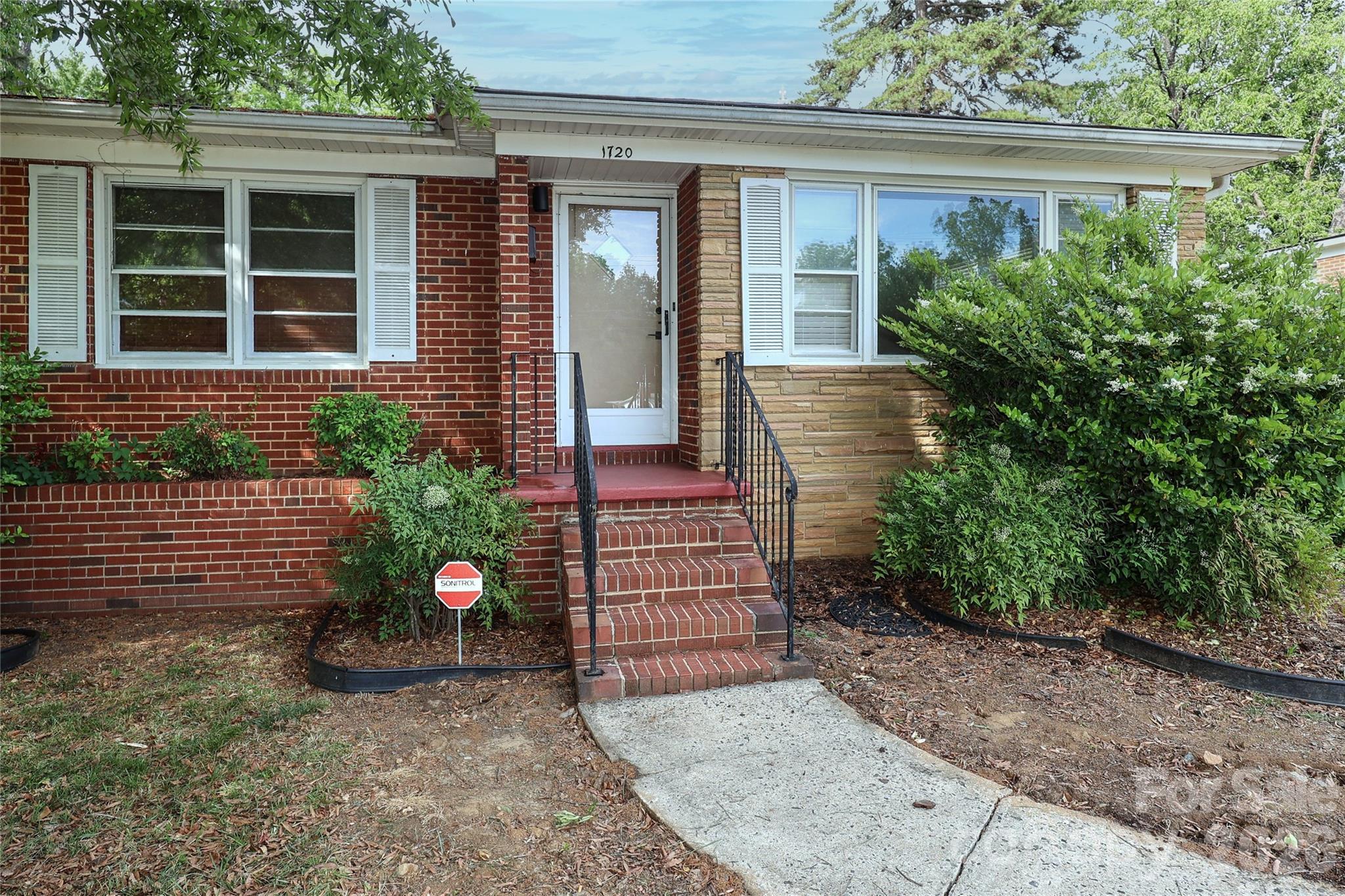DESIRABLE NORTHEND HISTORIC DISTRICT! Fully remodeled, all brick transitional ranch home in the popular historic NorthEnd Oaklawn Park community. New features inside include complete kitchen remodel with light cabinets, stainless appliances, new quartz countertops, and tile backsplash. Spacious primary bedroom. Fully updated bathrooms, including ensuite primary bath. Gorgeous original hardwood floors thruout most of the main level. New 30-year architectural shingle roof and gutters. Nice size screened in porch. Fenced back yard. Two-car carport with storage. Walking distance to the CityLYNX Gold Line which runs thru Biddleville, Wesley Heights, Uptown, and Elizabeth. $500,000+ new construction and remodeled homes all around. Less than a mile to Uptown Charlotte!!