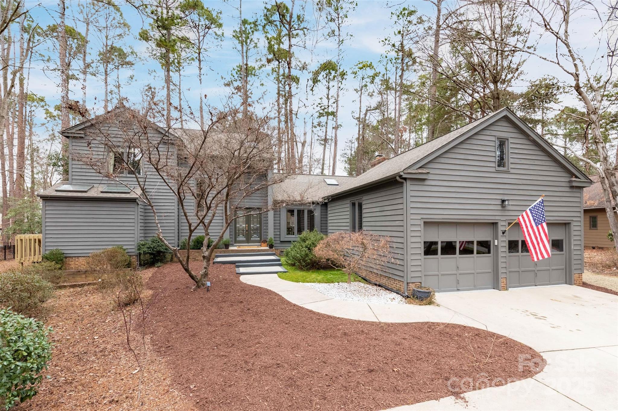 Welcome to your dream home in the prestigious River Hills golf course community. Step inside to discover newly refinished hardwood floors and an abundance of natural light that create an inviting ambiance from the moment you enter. The bright, white Kitchen is a chef's delight, featuring double ovens, a gas cooktop, ample counter space, and plenty of storage. Adjacent to the Kitchen, the Keeping Room with a wood-burning fireplace offers a perfect space for entertaining. Updated Laundry Room and Powder Room. The Primary Bedroom and Bathroom are conveniently located on the main level. The primary Bathroom features a new vanity, countertop, sinks, and faucets. Three additional bedrooms and a full bathroom complete the upstairs. New carpet. Outside, a spacious deck spans the full width of the house, overlooking a flat, fenced yard complete with a fire pit—ideal for outdoor gatherings. This home is both comfortable and inviting, ready to welcome you!