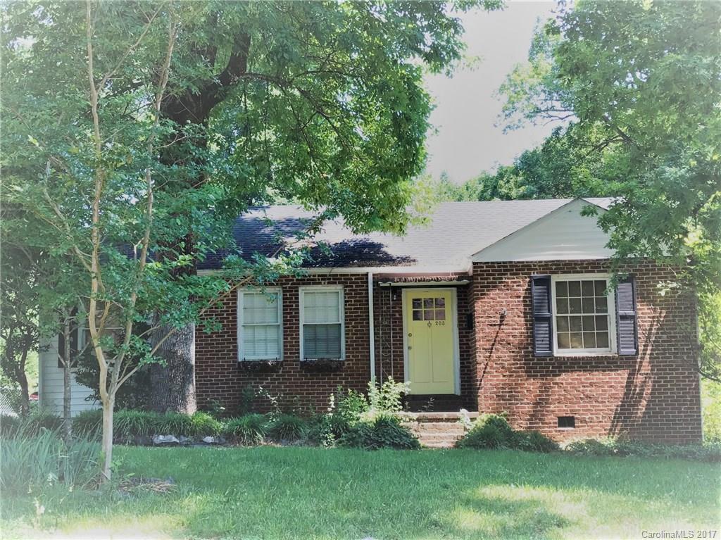 Cute and charming home located on a corner lot with tree lined fenced in back yard. So much potential for the right buyer in this PRIME location. Detached garage does have power, could be turned into a workshop area. Original hardwood floors. The roof was replaced in 2012, HVAC rep in 2007, and electric wiring was updated in 2009. Home does need repairs and is being sold AS-IS. This home is 3 bedrooms(though one bedroom is small and could be used more for an office)