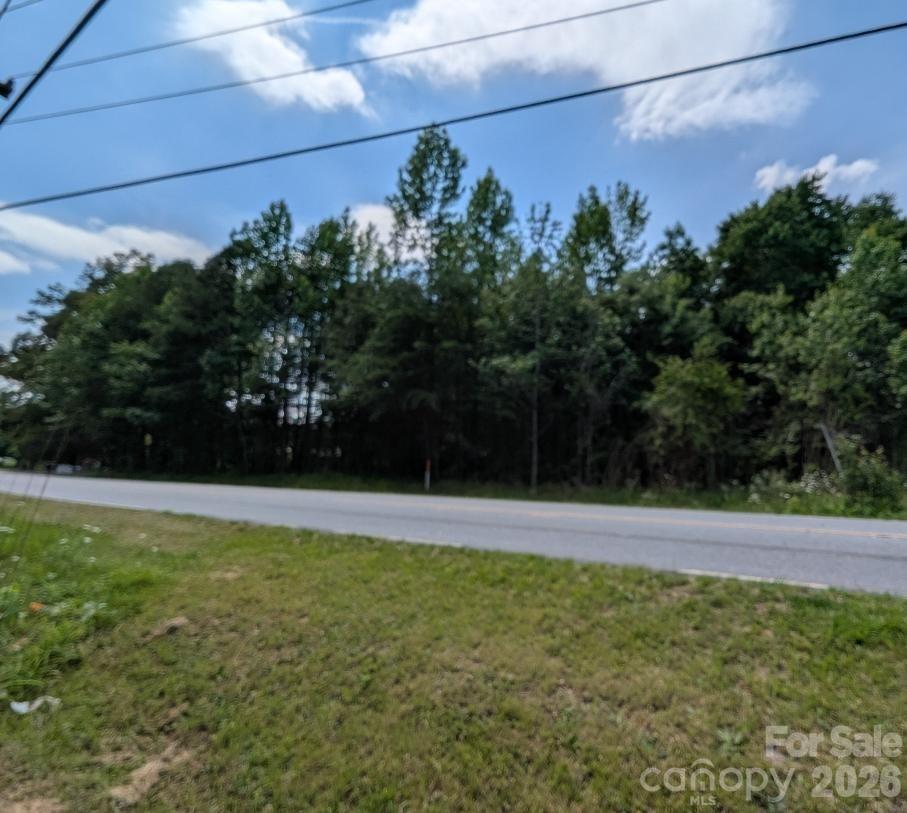 Over a half acre lot on the lower end of Springs Road.  There is a well on the property but unsure if it is usable.  City water is available for hook up through the city of Hickory.  Lot will need a septic tank installed.  The lot is zoned R-20 and is not big enough to subdivide although it might meet the size requirement for a duplex.  No restriction against mobile homes has been found but would need to be verified by the buyer agent.  There is a mobile home on the lot adjacent to this one.  Listing agent is the owner.