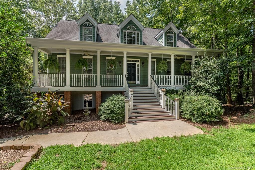 Back on market. Roomy Cape Cod tucked back amongst the trees on private lot. Extra parking under the rear deck behind 3 car garage. Granite island kitchen, formal dining, large great room, Master Suite on main level. Full length rear deck with large screened porch. Outdoor kitchen patio area with stone fireplace. Fenced rear yard backs up to wooded area. New carpet and fresh paint throughout. Pre wired as "Smart Home". Tiled basement rec room area could be in-law suite with existing full bath.