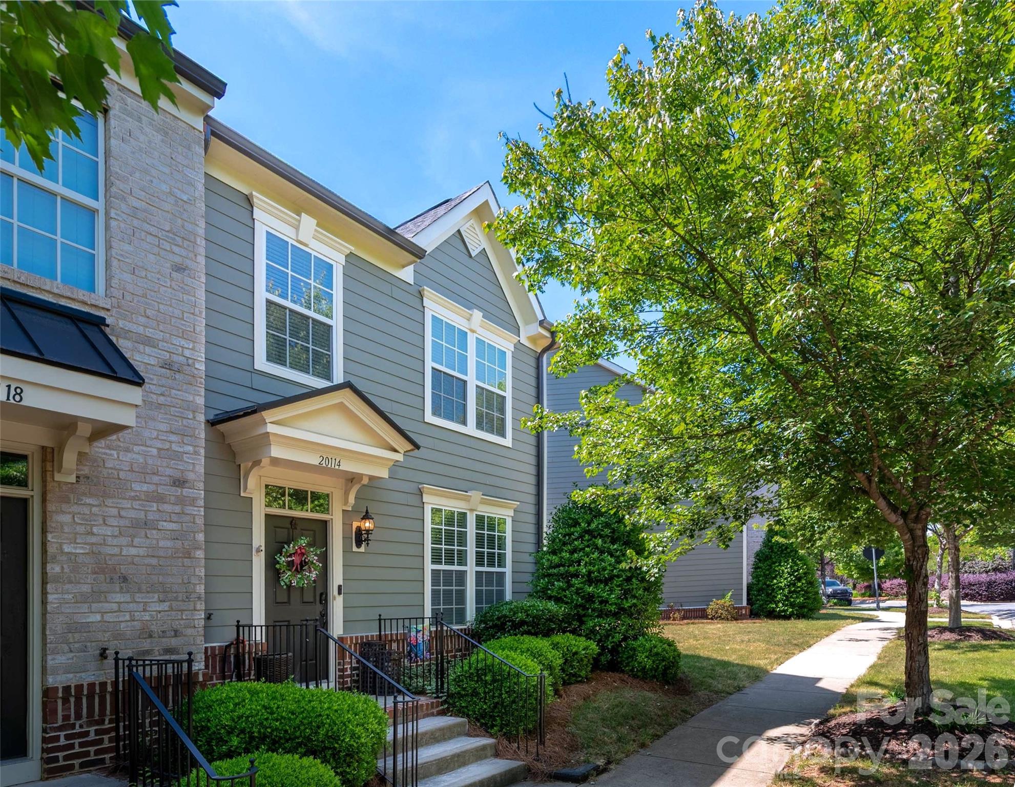 Located in the highly desirable Antiquity community, this beautiful end-unit townhome offers the perfect blend of comfort, convenience, and the Lake Norman lifestyle. Step inside to an open-concept main level with beautiful vinyl plank flooring throughout. The kitchen features abundant cabinetry, granite countertops, stainless steel appliances, and a large island perfect for entertaining. A spacious dining area and additional flex/sitting space lead to the fully fenced backyard with a patio and access to the oversized detached one-car garage. Upstairs, the primary suite includes a walk-in closet and ensuite bath with dual sinks, a garden tub, and separate tile shower w/ dual showerheads, while two additional bedrooms provide great space for family, guests, or a home office. Located across from a large green space with gazebo, this home offers a peaceful setting within the neighborhood. Enjoy easy access to the community pool, dog park, and greenway trail, along with shops, dining, and grocery stores located at the entrance to the neighborhood. Convenient to Old Town Cornelius, Cain Center for the Arts, breweries, festivals, Lake Norman, I-77, and just minutes from downtown Davidson with its charming Main Street, farmers market, concerts, local restaurants, coffee shops, and community events. Don't miss your opportunity to enjoy low-maintenance living in one of Cornelius’ most sought-after communities!