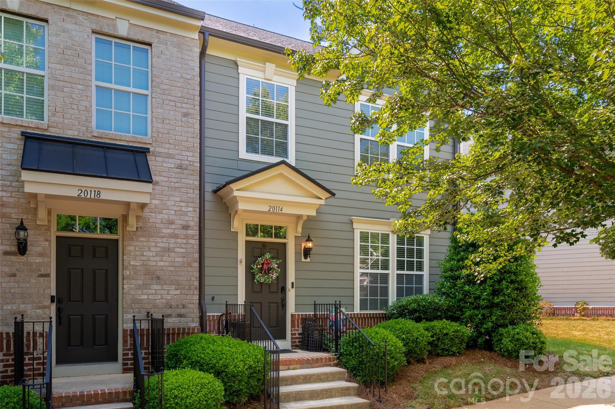 Located in the highly desirable Antiquity community, this beautiful end-unit townhome offers the perfect blend of comfort, convenience, and the Lake Norman lifestyle. Step inside to an open-concept main level with beautiful vinyl plank flooring throughout. The kitchen features abundant cabinetry, granite countertops, stainless steel appliances, and a large island perfect for entertaining. A spacious dining area and additional flex/sitting space lead to the fully fenced backyard with a patio and access to the oversized detached one-car garage. Upstairs, the primary suite includes a walk-in closet and ensuite bath with dual sinks, a garden tub, and separate tile shower w/ dual showerheads, while two additional bedrooms provide great space for family, guests, or a home office. Located across from a large green space with gazebo, this home offers a peaceful setting within the neighborhood. Enjoy easy access to the community pool, dog park, and greenway trail, along with shops, dining, and grocery stores located at the entrance to the neighborhood. Convenient to Old Town Cornelius, Cain Center for the Arts, breweries, festivals, Lake Norman, I-77, and just minutes from downtown Davidson with its charming Main Street, farmers market, concerts, local restaurants, coffee shops, and community events. Don't miss your opportunity to enjoy low-maintenance living in one of Cornelius’ most sought-after communities!
