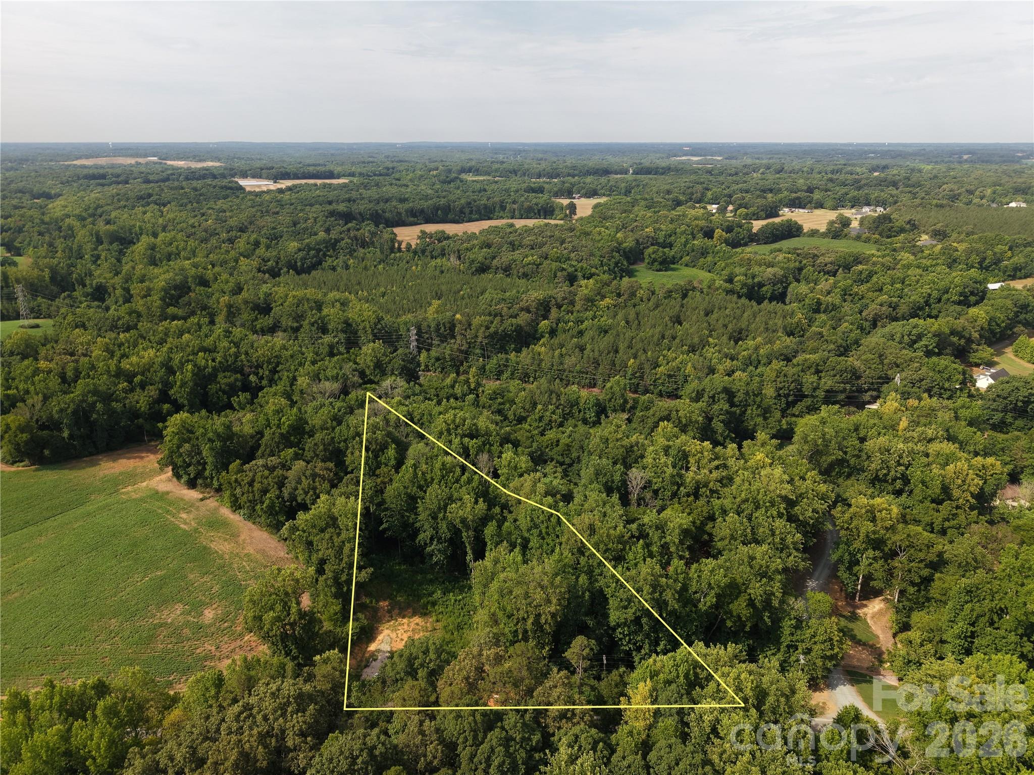 Looking for that perfect build site for your forever home.  Look no further.  This 2.58 acre tract in Monroe, NC checks all the boxes.  The versatility and privacy of country living and only minutes from the hustle and bustle of the city and downtown amenities.  Take this blank canvas and make it your own, with no known restrictions the possibilities are endless.  Well and septic are needed.