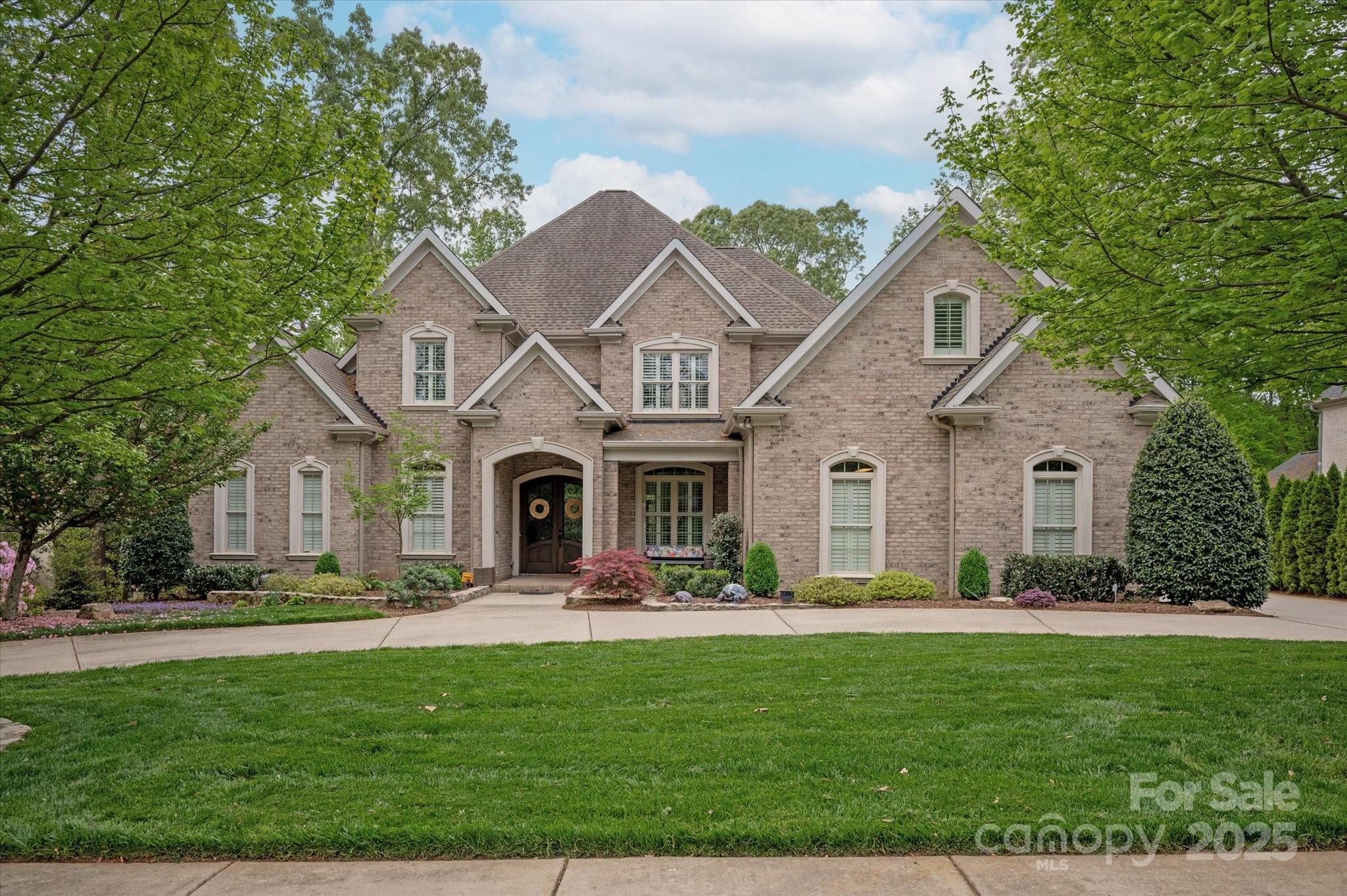 Stunning Springfield (Fort Mill, SC) home that offers an inground gunite pool with hot tub and infinity edge overlooking the Golf Course. Accented with a Pool Cabana with outdoor 1/2 bath; built in griling station; fireplace and travertine decking. Interior will also not disappoint even your most picky of clients. Fully renovated gourmet kitchen with soft closed doors/drawers; Thermador SS Appliances; additional built ins and custom mill work. Primary on main level with door leading to back covered patio and pool area. Upstairs you will find 3 additional bedrooms; PLUS an in law suite and a seperate bonus room. This home shows beautifully and is a wonderful opportunity to live in the Amenity Driven Springfield neighborhood. Entered for COMP purposes only