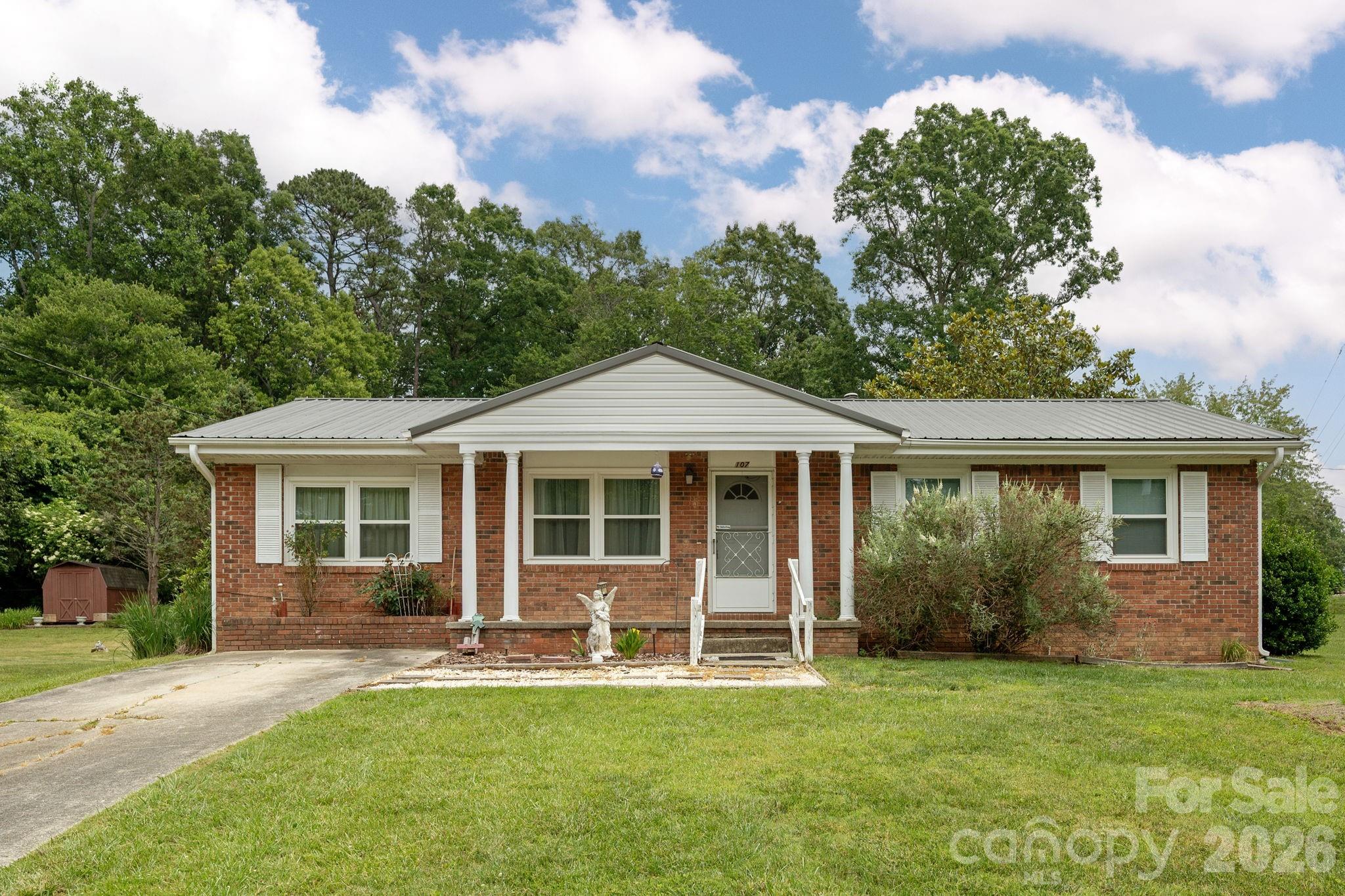 Home sweet Home! This home features 3 bedrooms and 1 and 1/2 baths. Great location and close to shopping and dining. Brick exterior and metal roof offer low maintenance. New windows and sliding door installed in 2023.New carpet installed in the bedrooms in 2023. Storage shed located in back yard and is perfect for a workshop. Great home for someone looking for easy one level living.