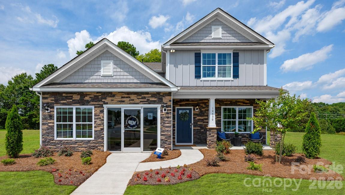 Tap Root Farms is a master planned community in Fletcher, NC featuring well-appointed single level and 2-story homes. Community features will include a 5,000 square foot resort style clubhouse with gym, large pool, playground, pickle ball courts and dog park. This home offers all of the features that you could want! With a primary suite on both the first and seconds floors, as well as two additional bedrooms upstairs, there is plenty of room. The kitchen features beautiful countertops, shaker cabinets, and ss appliances. With nine-foot ceilings throughout the first floor, mohawk flooring, and a smart home package, this home is ready for everyone! *Home features are subject to change without notice. Internet service not included. Sq footages are approximate*