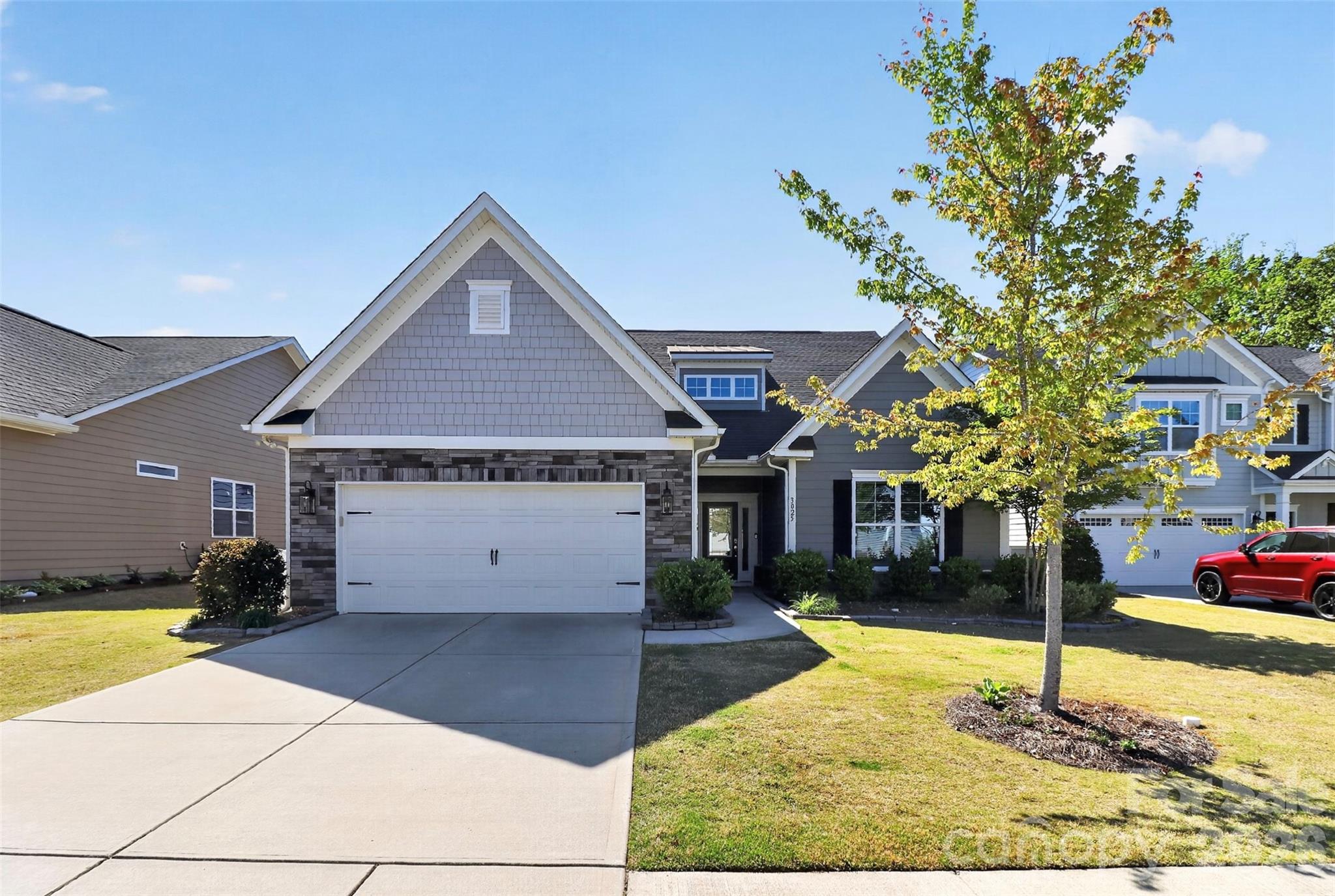 Welcome Home to 3025 Kinsley CT! This stunning 1.5 story home offers a convenient location plus style. Hosting 2 of 3 bedrooms + office on Main along with seamless flow of living spaces.  Primary Bedroom on Main. Kitchen features SS Appliances, Gas Range, Granite Countertops and large Island w/extra seating. Upstairs you will find a private retreat providing you with a Bonus room/area, 3rd bedroom & 3rd full bath + flex room that could double as a 2nd office. Relax, enjoy morning coffee on the privacy of your screened rear porch.  Have an EV? - we have a Tesla Charging system (inside the 2 car garage) awaiting you!  Home filled with Energy saving items: appliances, Gas Tankless hot water heater, 2 gas Furnace systems, 2 Central Air Systems (zoned);  Cul-de-sac lot in community; located conveniently to shopping, dining, only minutes from Ballantyne. Lawn Maintenance/Mowing provided in your monthly HOA fees.