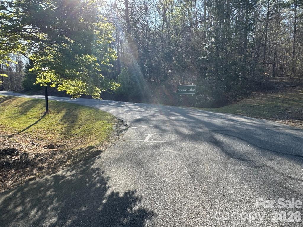 Discover the perfect place to build your dream home in the desirable Willow Lakes community of Rutherford County. Tucked away on a quiet cul-de-sac, this beautiful 2.4 acre lot offers a peaceful setting with well-maintained paved roads, abundant natural beauty, and local wildlife.

This vacant land gives you the best of both worlds. It feels private and serene, yet it is just minutes from historic Rutherfordton, where you will find shopping, dining, and medical facilities close by.

Centrally located about 60 miles from Asheville, Charlotte, and Greenville, SC, this property offers small-town charm with convenient access to major city amenities. It is also conveniently located near Tryon International Equestrian Center, making it a great option for equestrian enthusiasts or anyone who enjoys world-class events.

With nearby hiking trails, parks, and scenic countryside, this property is a great opportunity to create the lifestyle you have been looking for. Do not miss your chance to own this exceptional homesite. Schedule your visit today.