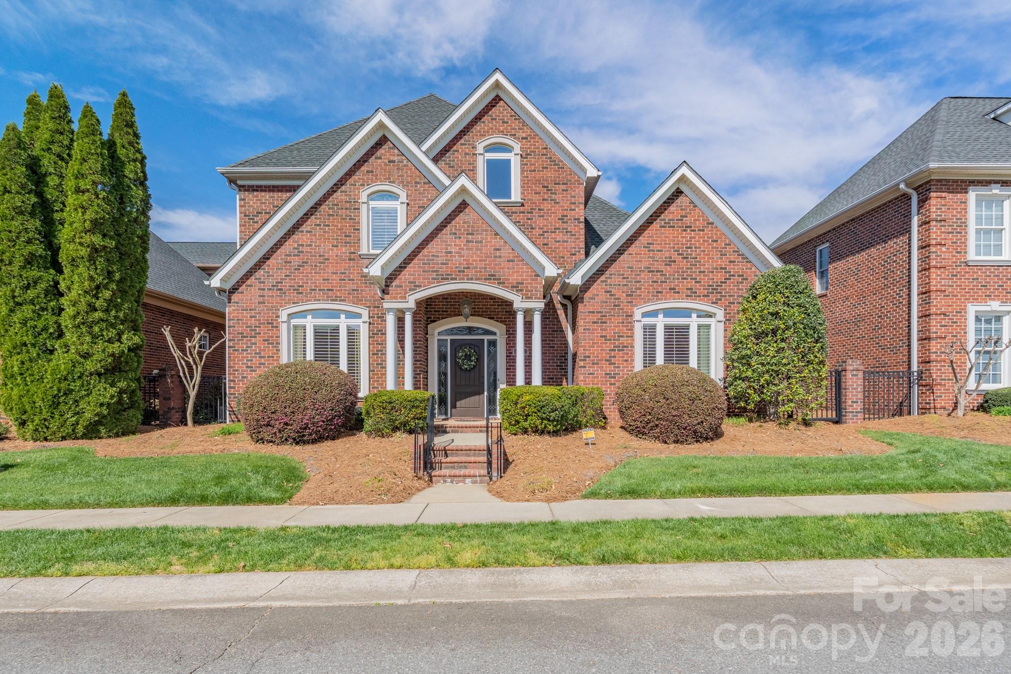 This one is going to impress you!  Located in Augusta Place at Laurel Creek, it boasts four bedrooms as well as four-and-a-half baths.  The main level living space features beautiful plank flooring and gorgeous trim woodwork.  The open kitchen is a chef’s delight with stainless appliances, granite countertops, and custom cabinetry.  You will love the entertainment space with both a breakfast area and a separate dining room.  The primary suite is located on the main level with a private bath featuring tile shower and soaking tub.   A second bedroom is on the main level (currently serving as a home office) as well as a second full bath and powder room.  Upstairs is home to two additional large bedrooms, each with their private en suite full bathrooms!  There is gracious room for overnight guests with their own private retreat area.  A double garage provides space for vehicles as well as storage and the space over the garage is a bonus with walk-up storage space.  Located in a prime neighborhood with access to community pool, tennis courts, and walking trails, this one will check off the boxes on your wish list!  Looking for lawn care and maintenance and a less stressful lifestyle?  Come check out 213 Wrenfield Mill today!
