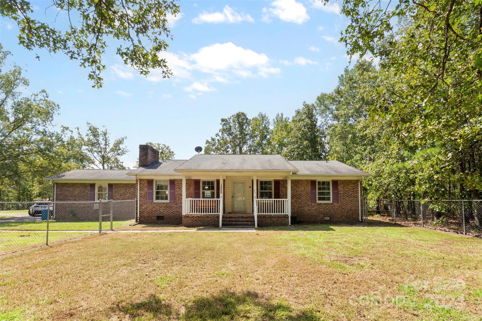 Welcome to this full brick ranch that truly has it all! Set on a sprawling 2-acre corner lot, this property is an absolute dream for hobbyists and those in need of extra space! Outside, you'll find two massive detached buildings: one measuring an impressive 30’x28’ and the other 24’x36’. Whether you're into car collections, woodworking, or just need a spot for family and friends to gather, these buildings offer endless possibilities. There is also an attached carport! Step inside to find a large entryway, a cozy family room featuring a warm, inviting fireplace—perfect for those cool evenings. The large kitchen, complete with a breakfast area, flows seamlessly into the dining room, making it ideal for family meals and entertaining. With 3 spacious bedrooms, 2 baths, and a convenient laundry room. Relax on the charming rocking chair front porch overlooking the fenced yard—perfect for pets or kids to play safely. Crawlspace encapsulated in 2024. NO HOA! Don't miss out, come see it today!