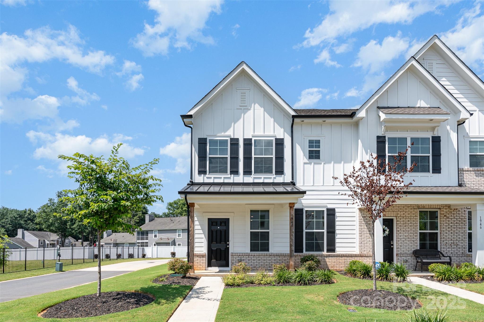 Like new end-unit townhome in Rock Hill! Ideally located near shopping, dining, and I-77 for easy commuting. You'll love the inviting covered front porch and airy 9-foot ceilings throughout. The kitchen features granite countertops, a walk-in pantry, and a 5-burner gas stove—perfect for everyday cooking or entertaining.
The spacious primary suite includes two walk-in closets, and both secondary bedrooms offer walk-in storage as well. A rear-load two-car garage and full driveway provide plenty of parking. Best of all, the HOA takes care of the lawn, so you can enjoy low-maintenance living.